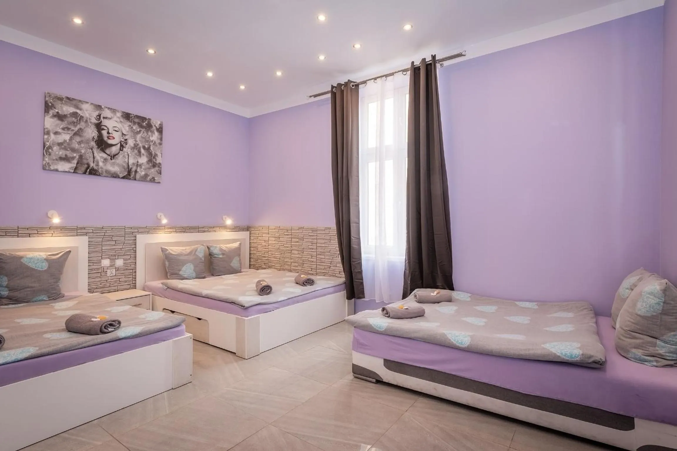 Bed in Queen Apartments