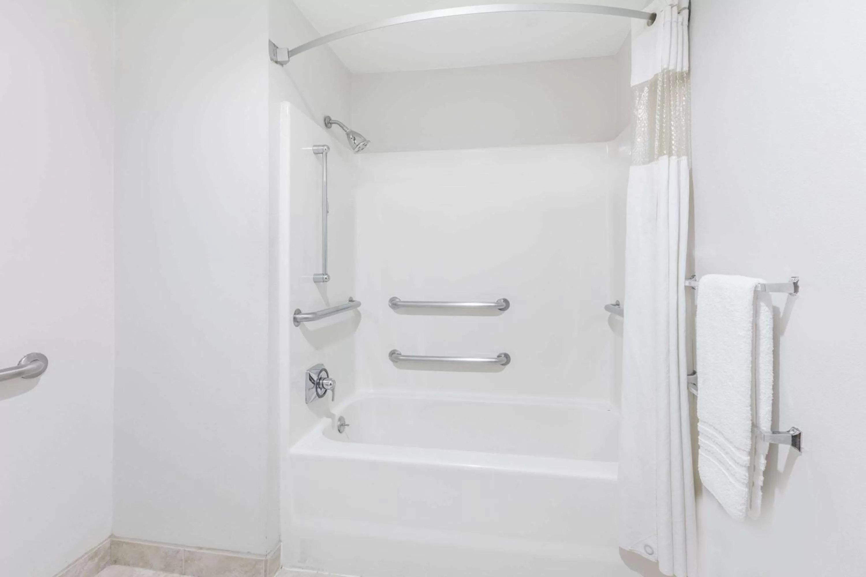 Bathroom in Baymont by Wyndham Arlington At Six Flags Dr