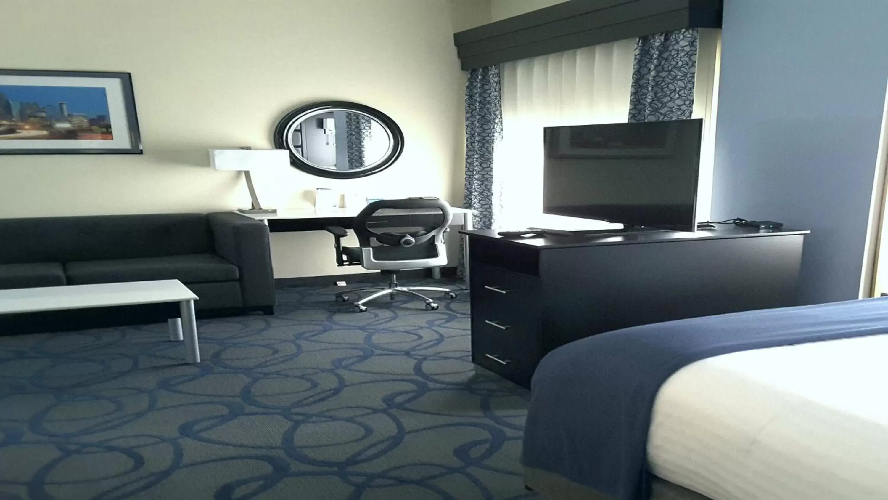 Photo of the whole room, TV/Entertainment Center in Holiday Inn Express Hotel & Suites Lawrenceville, an IHG Hotel