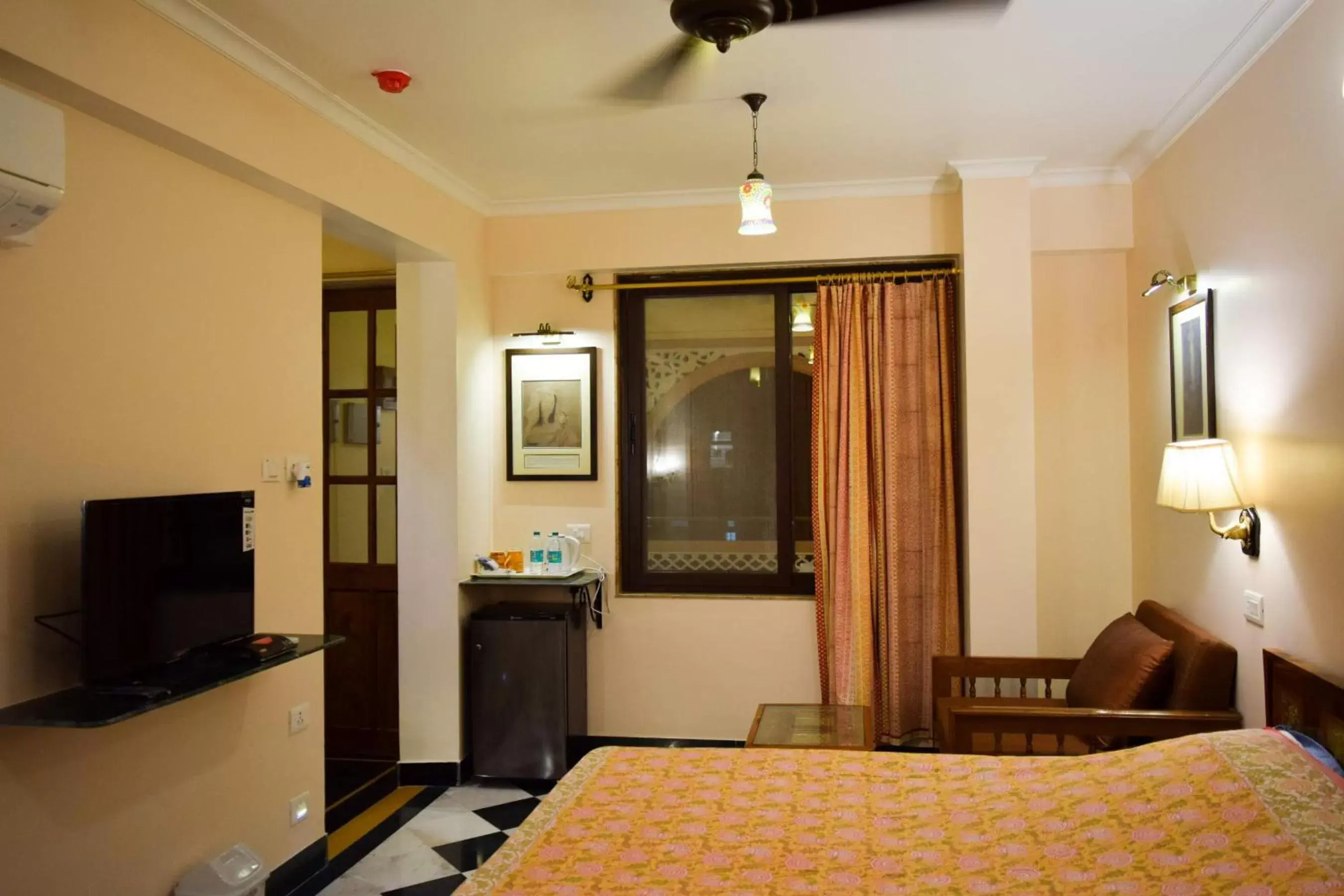 Photo of the whole room, TV/Entertainment Center in Hotel Arya Niwas