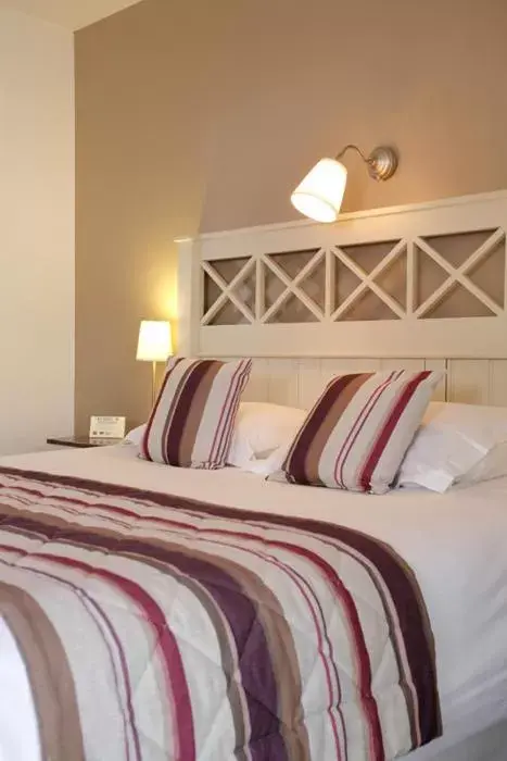 Bed in Logis Hotel, restaurant et spa Le Relais De Broceliande