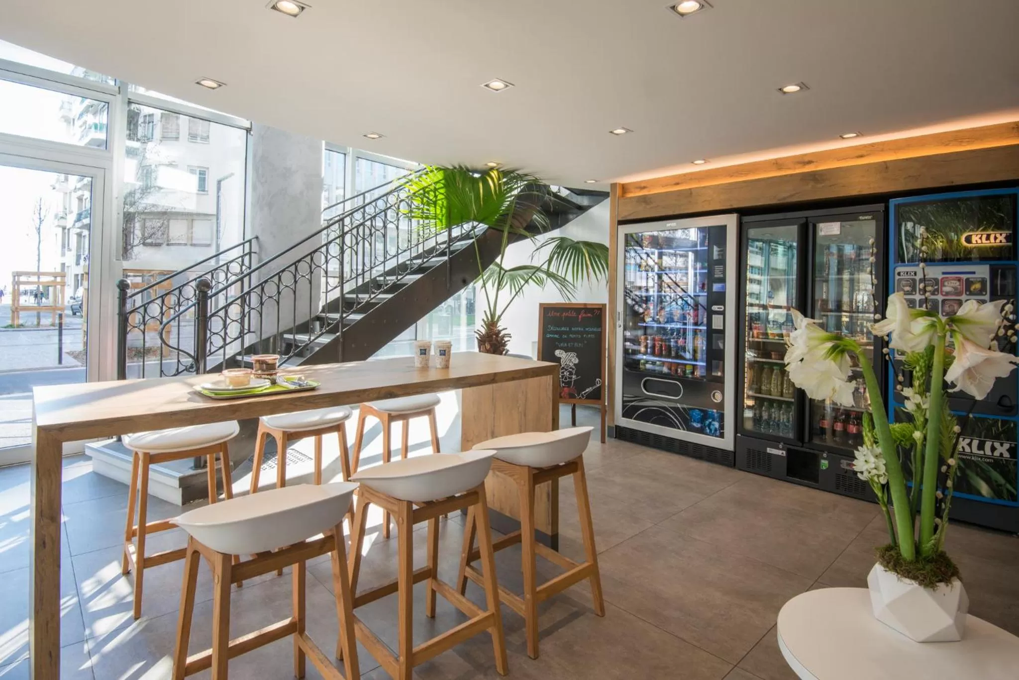 Communal lounge/ TV room in ibis budget Nice Californie Lenval