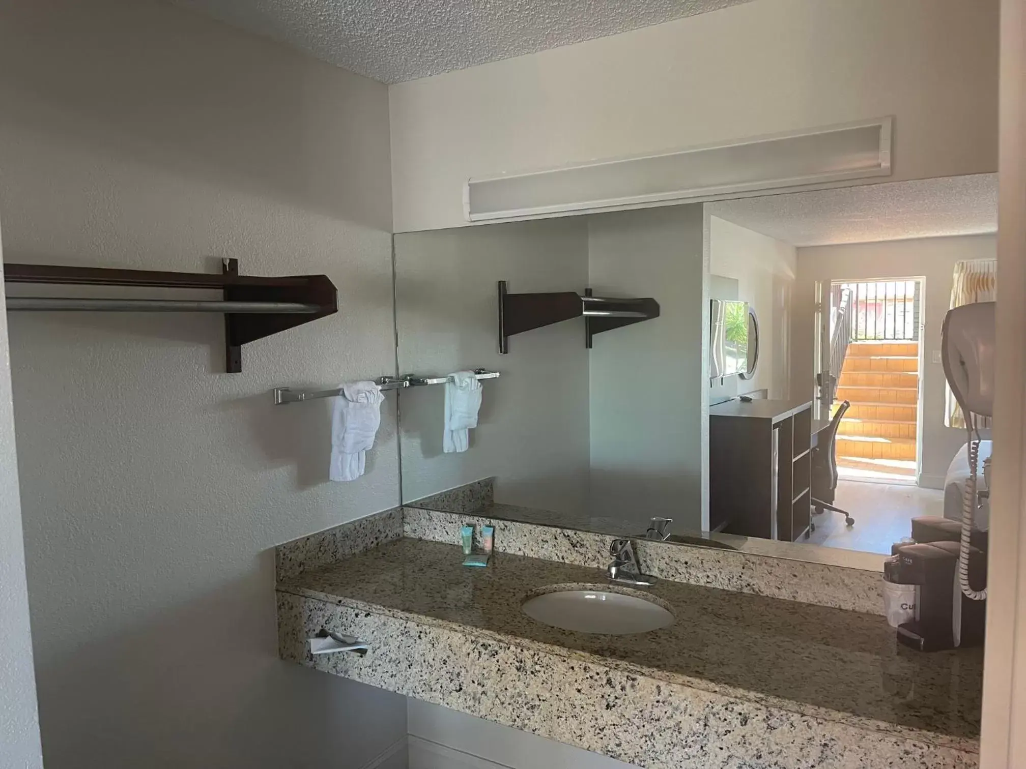 Bathroom in Days Inn & Suites by Wyndham Orlando East UCF Area