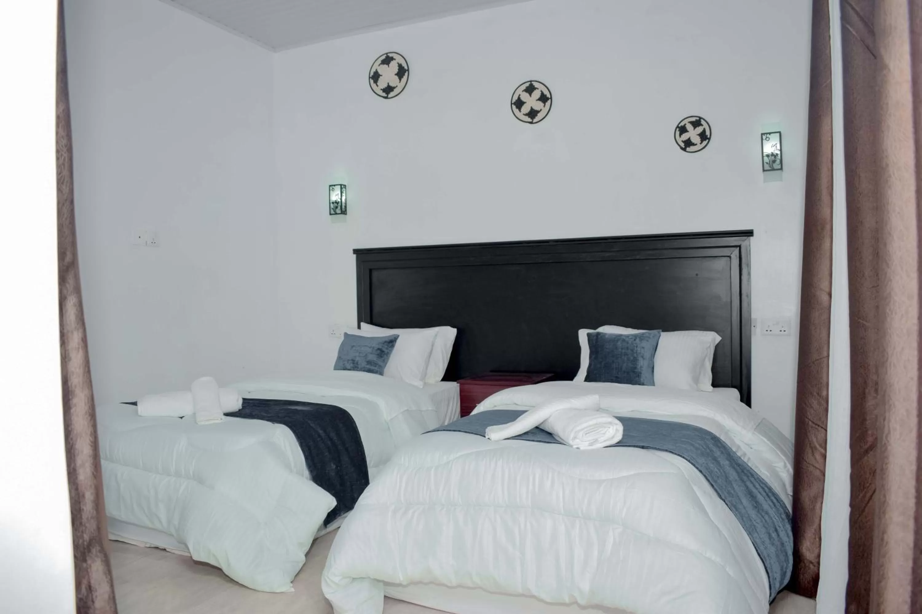 Bed in INZOZI AFRICA HOUSE B&B-Gishushu