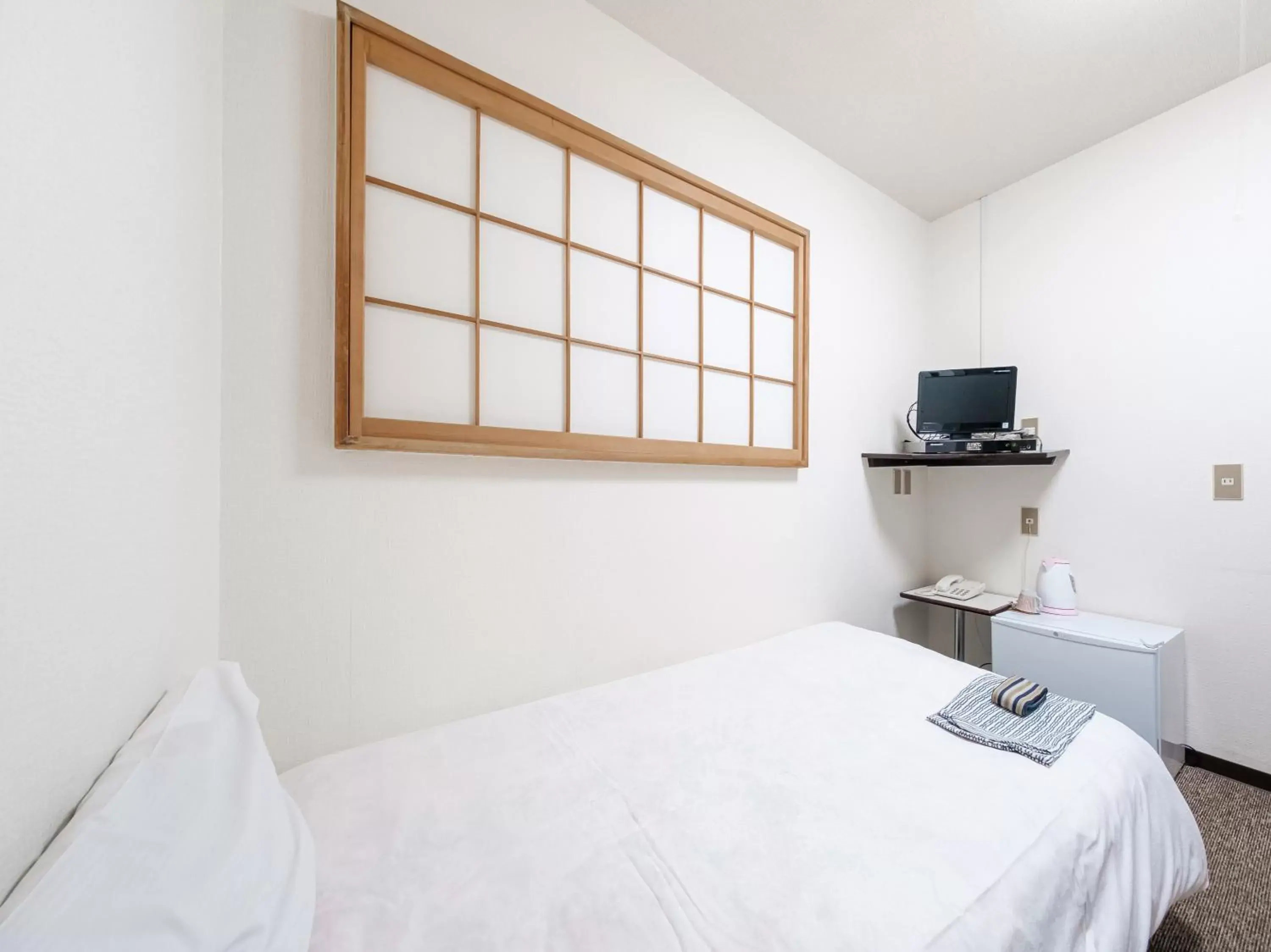 Bed in Tabist Hotel Tetora Hakodate Station