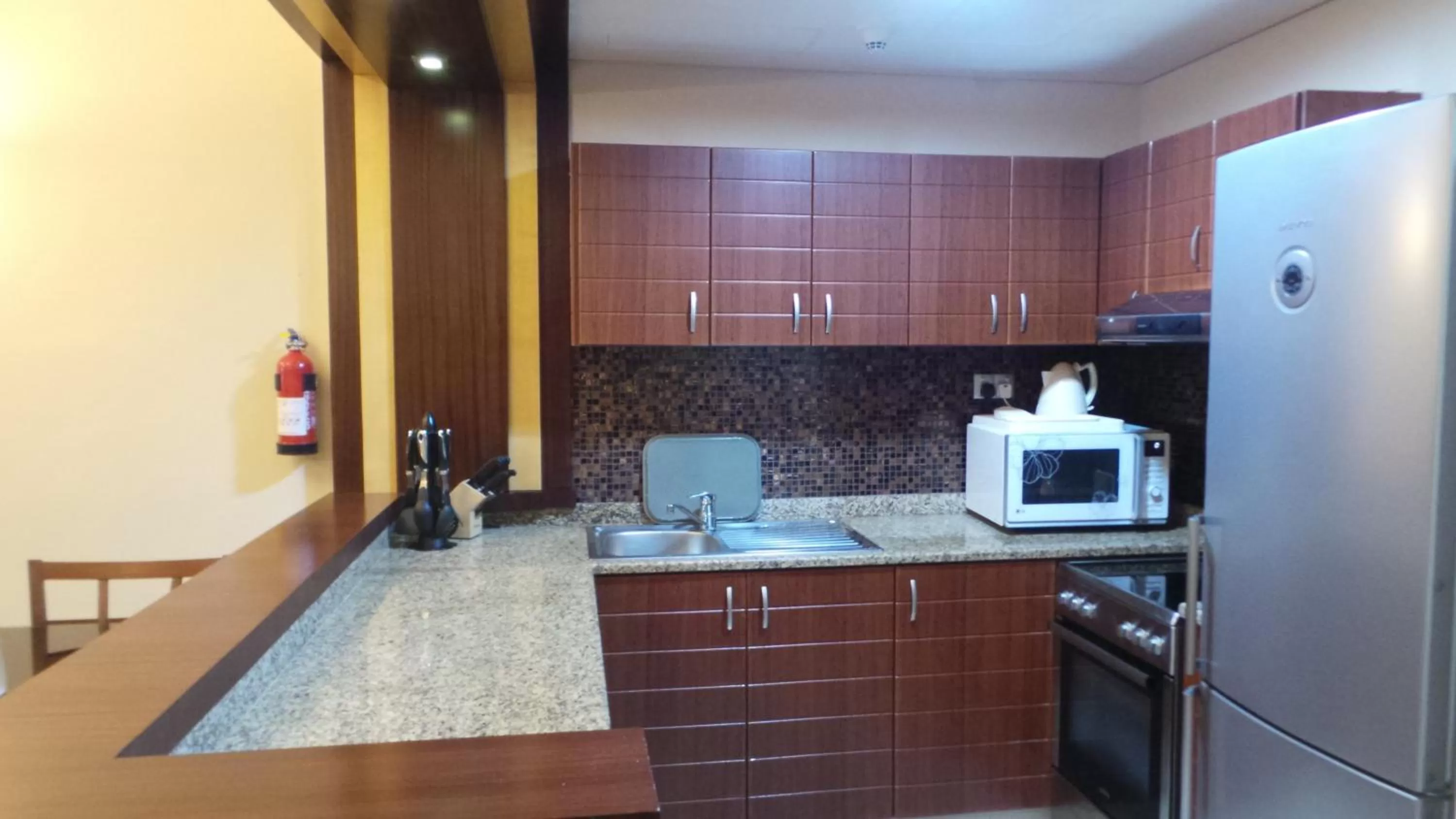 Kitchen or kitchenette in Xclusive Maples Hotel Apartment