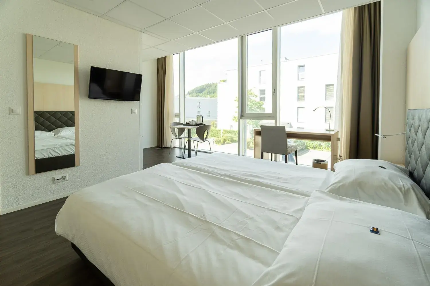 Photo of the whole room, Bed in Hotel Hine Adon Bern Airport