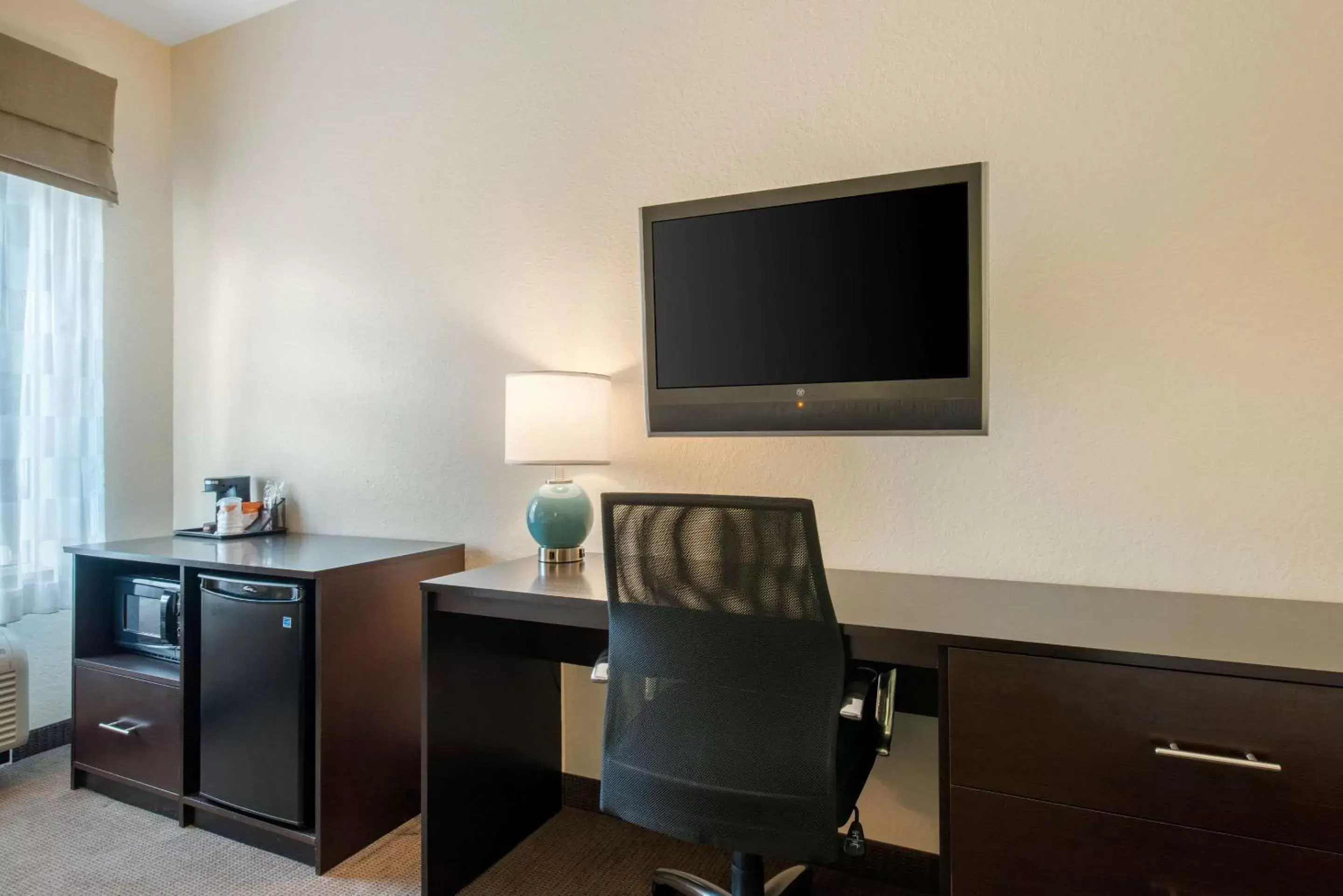 Photo of the whole room, TV/Entertainment Center in Sleep Inn & Suites Port Charlotte-Punta Gorda