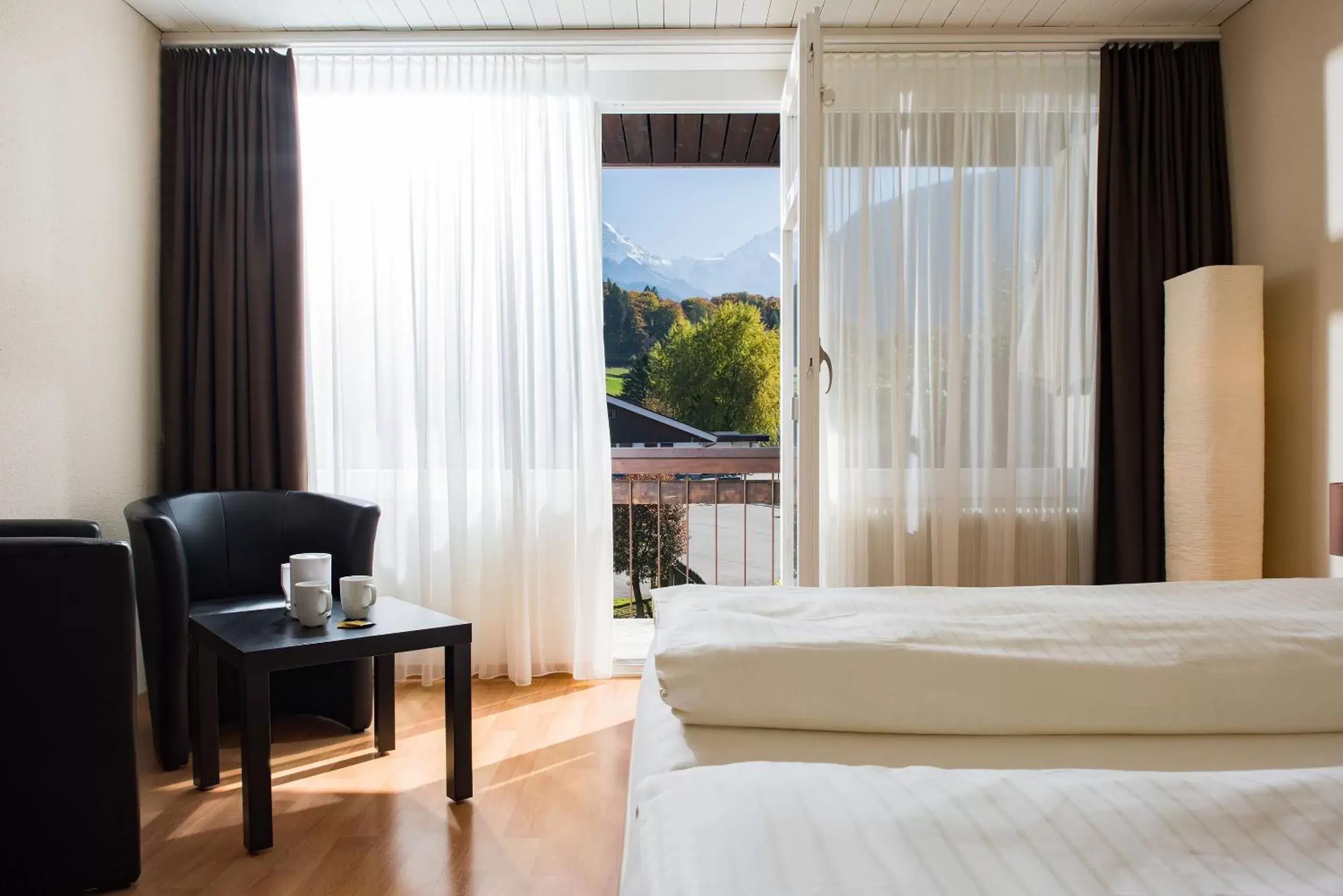 Bed in Jungfrau Hotel Annex Alpine-Inn