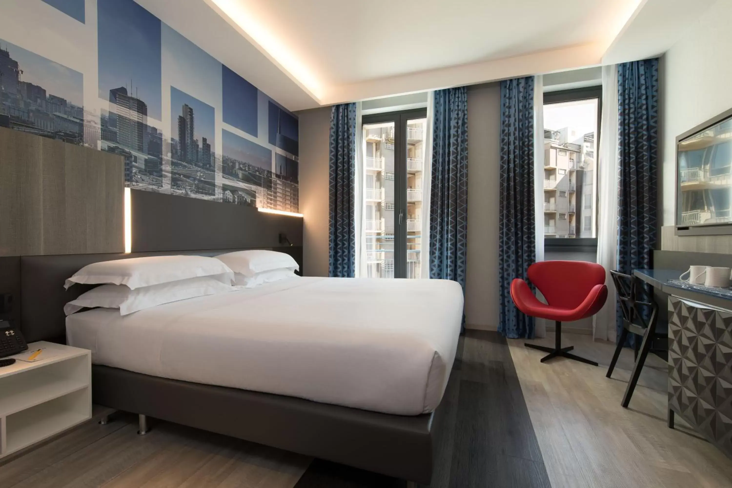 Bed in iQ Hotel Milano