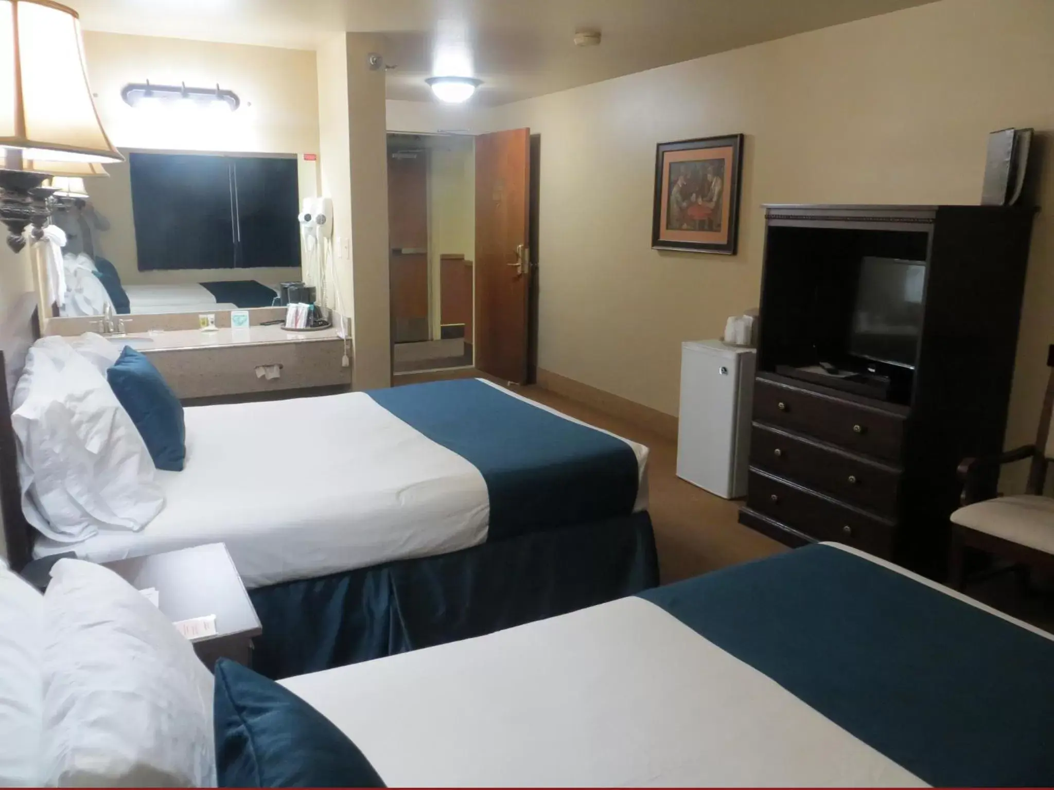 Bed, TV/Entertainment Center in First Gold Gaming Resort