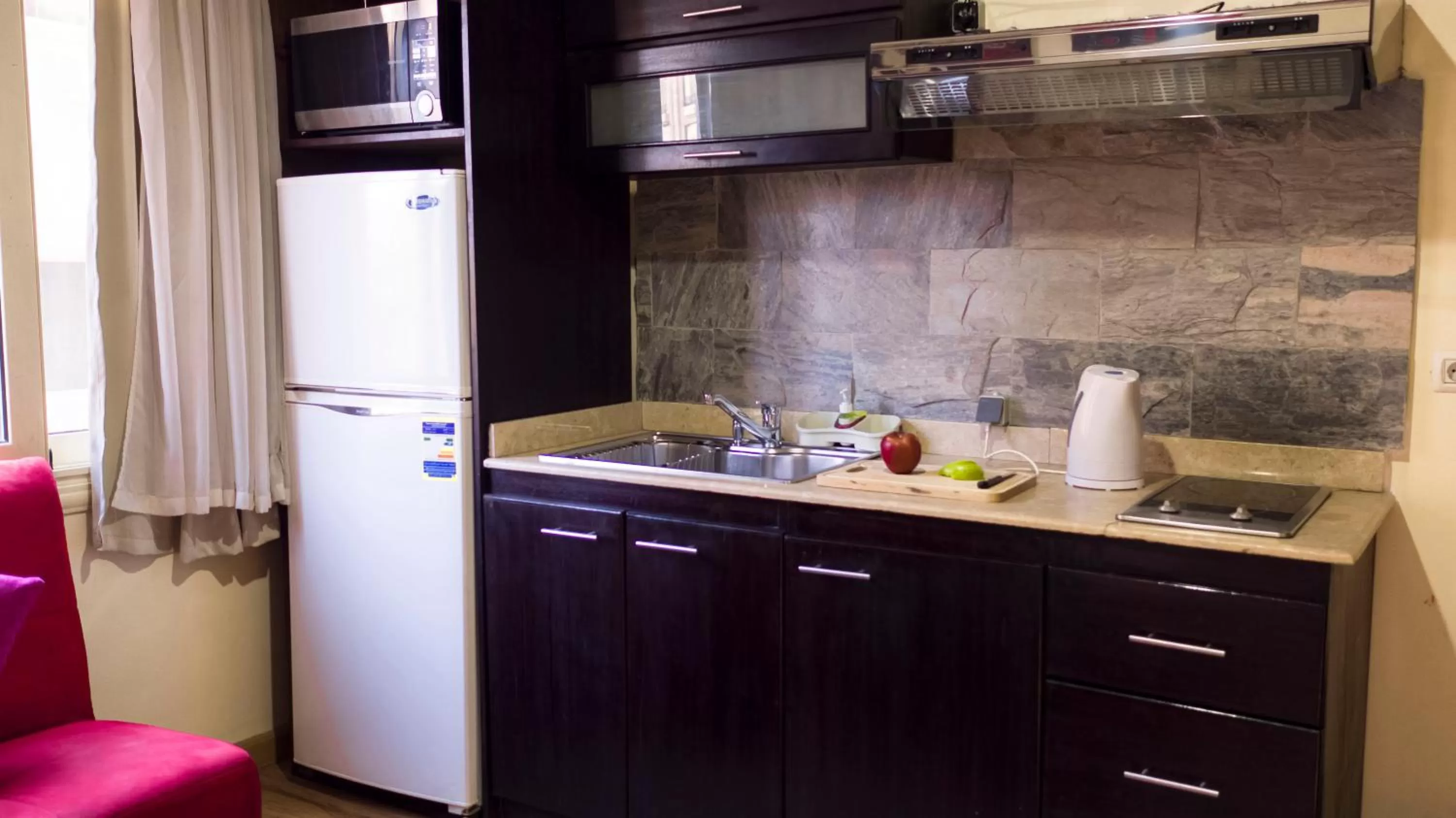 Kitchen or kitchenette in NewCity Hotel & Suites