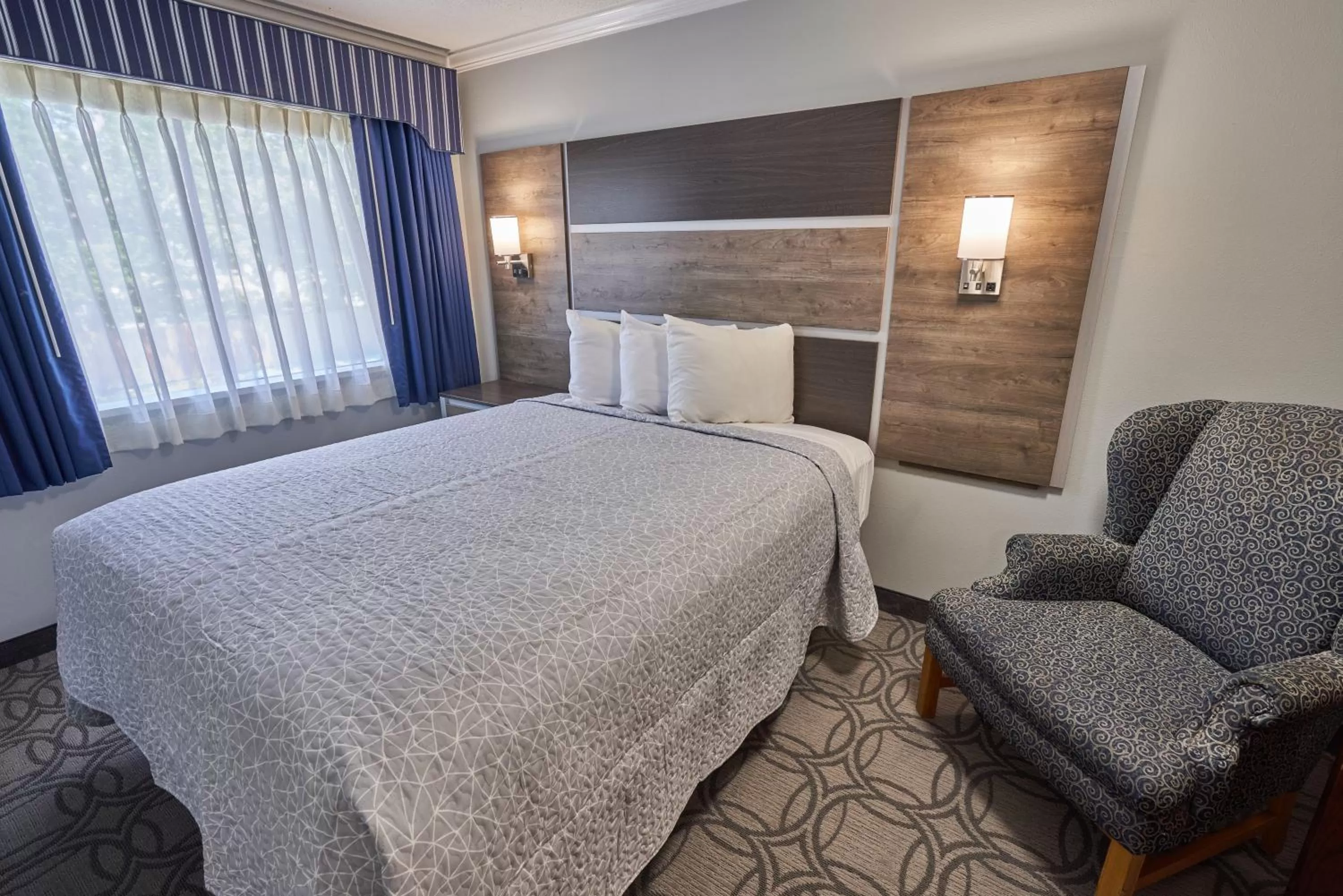 Bed in Ambassador Inn and Suites