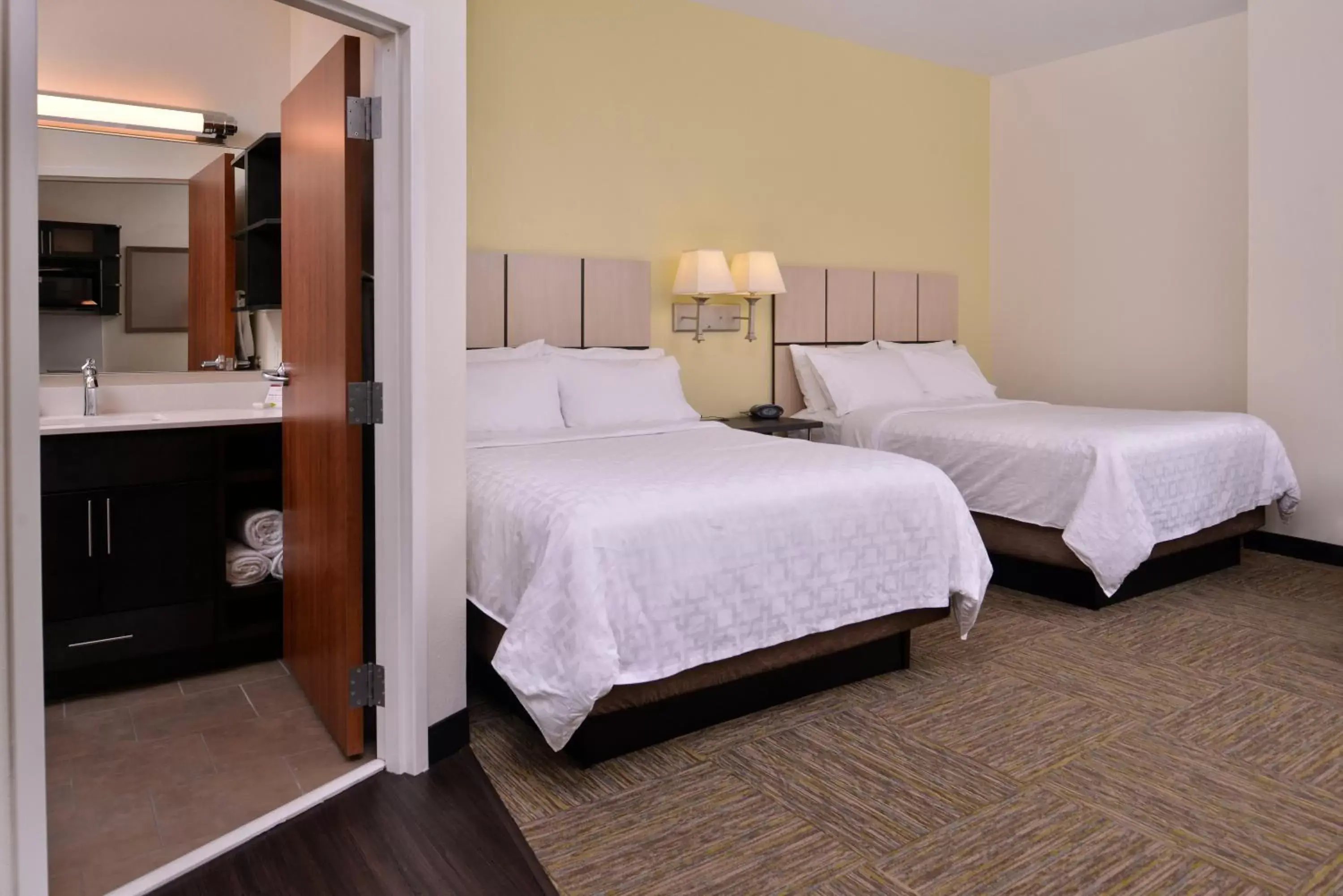 Photo of the whole room, Bed in Candlewood Suites Terre Haute, an IHG Hotel