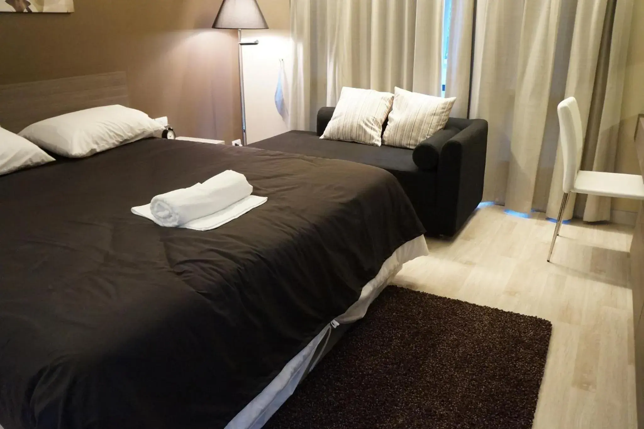 Photo of the whole room, Bed in Avatar Suites Hotel - SHA Extra Plus