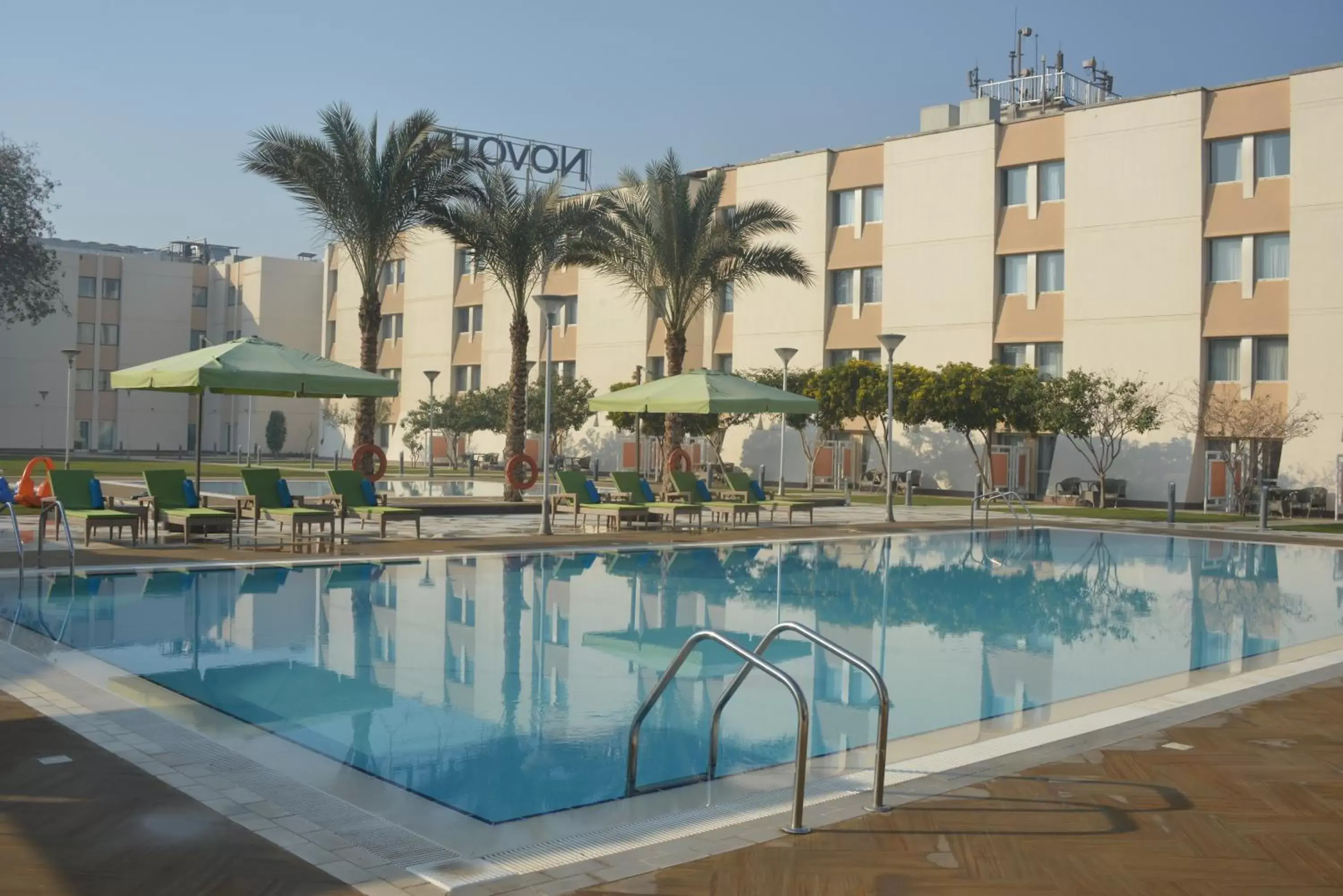 Swimming pool, Property Building in Novotel Cairo Airport