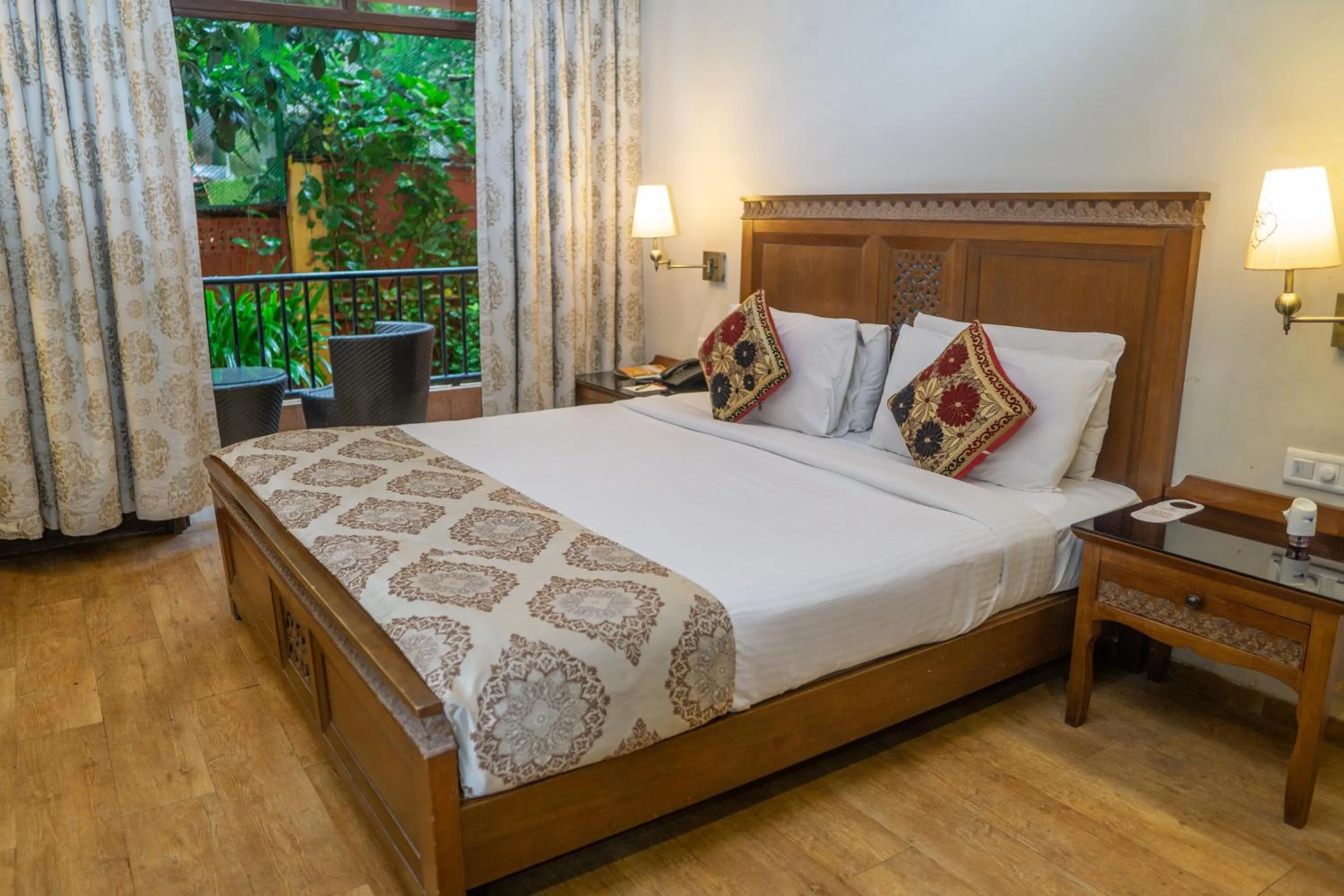 Bed in Neelam's The Grand Hotel Goa
