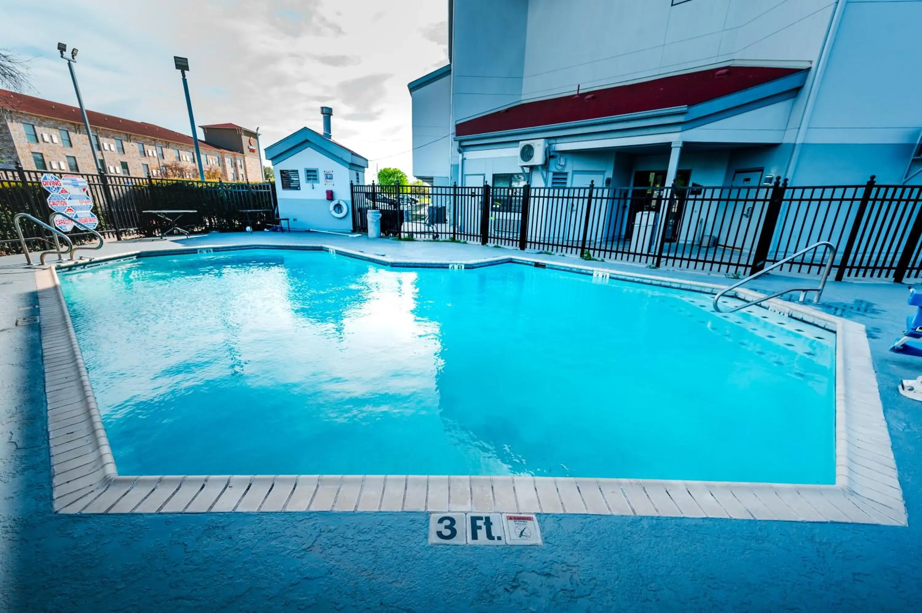 Swimming Pool in HomeTowne Studios by Red Roof San Antonio - SeaWorld Northwest