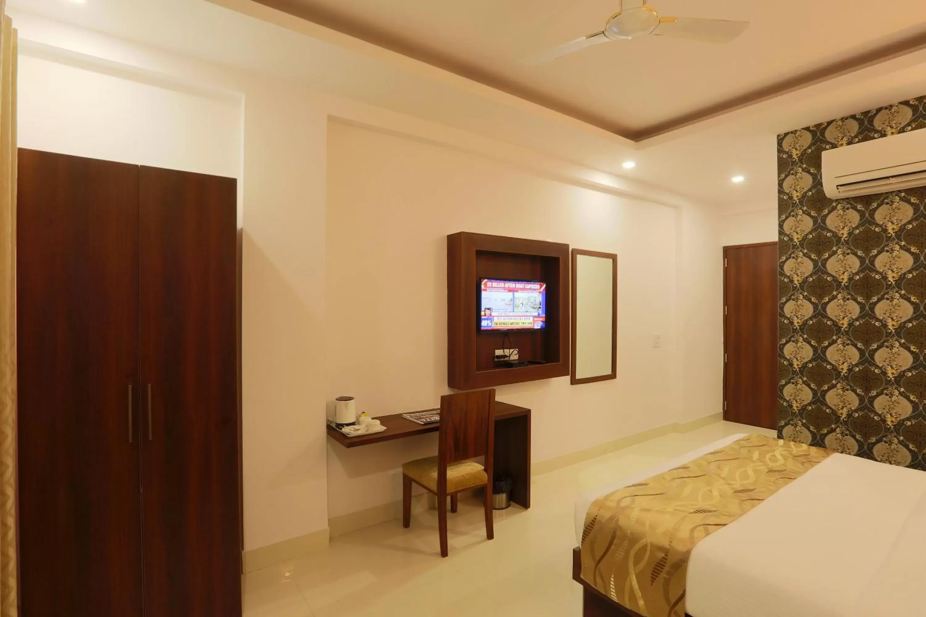 Bed, TV/Entertainment Center in Hotel Arch - Near Aerocity New Delhi