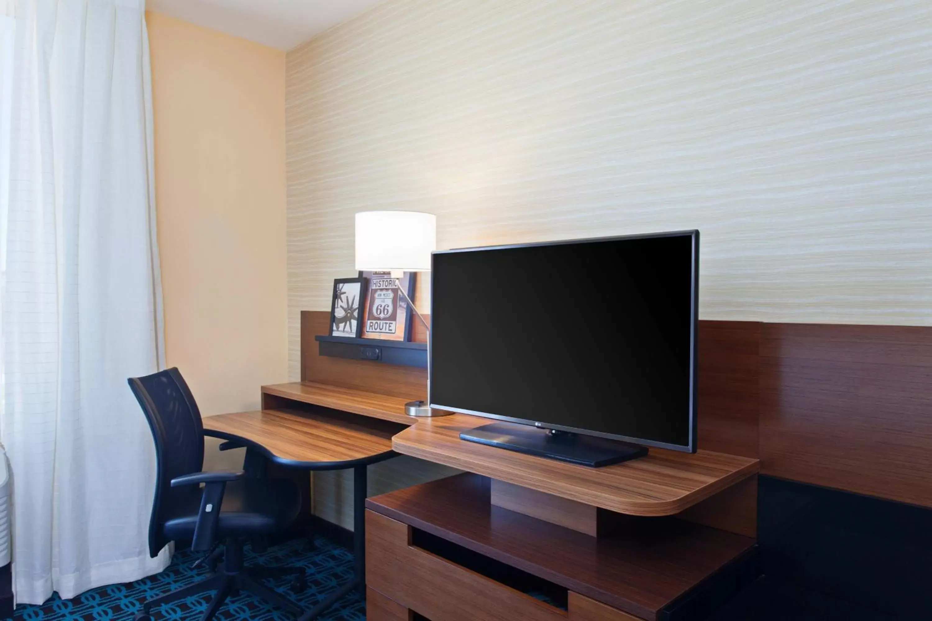 Photo of the whole room, TV/Entertainment Center in Fairfield Inn & Suites by Marriott Tucumcari