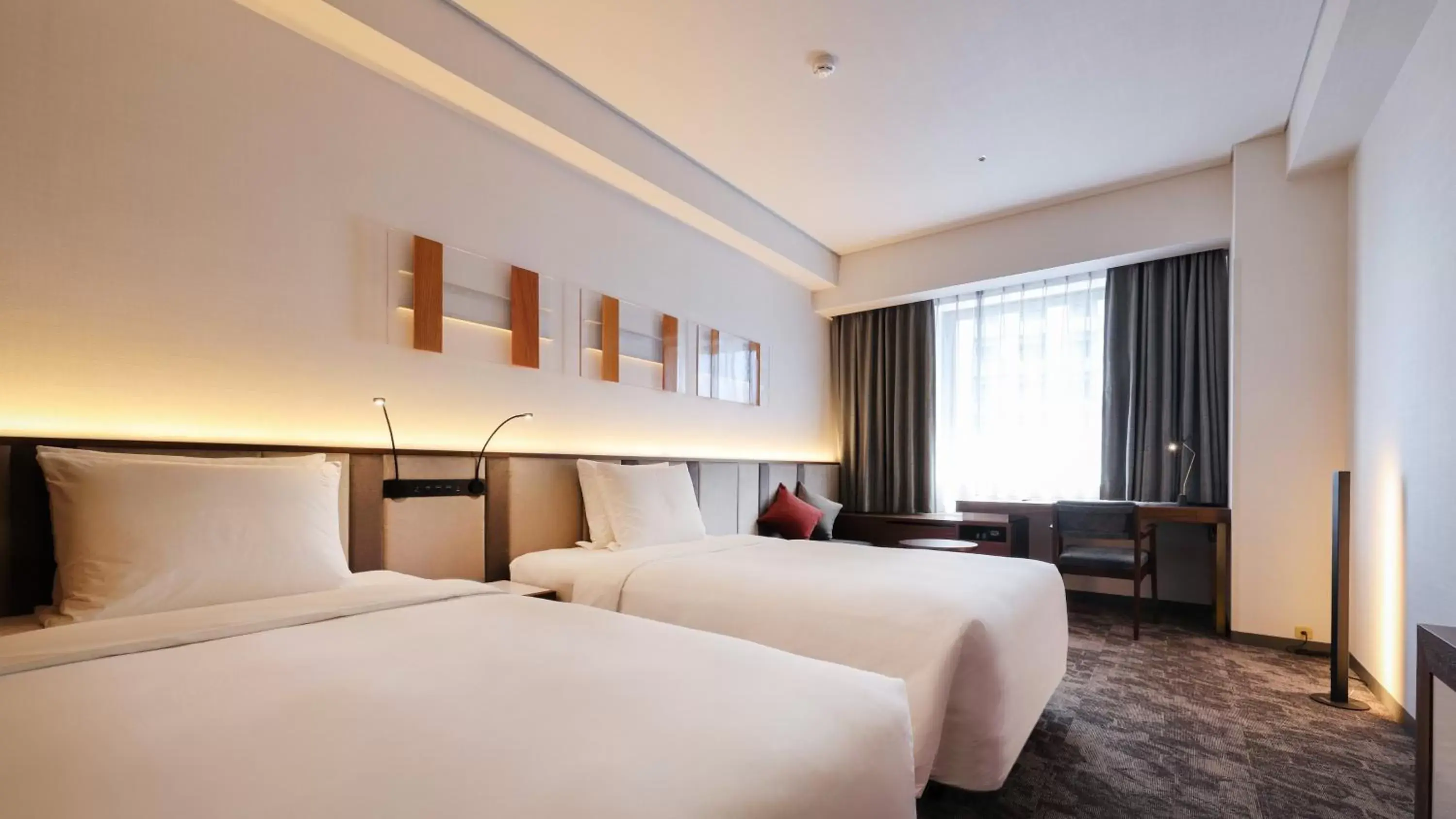 Bed in ANA Holiday Inn Sendai, an IHG Hotel