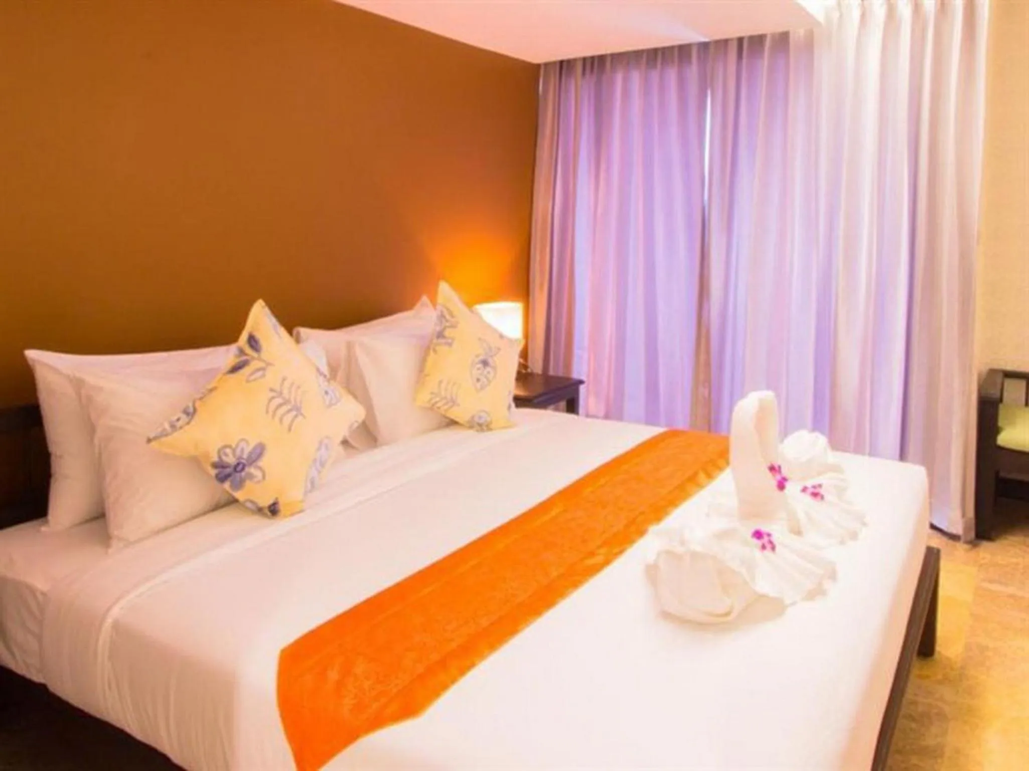 Bed in All Together Suite Hotel