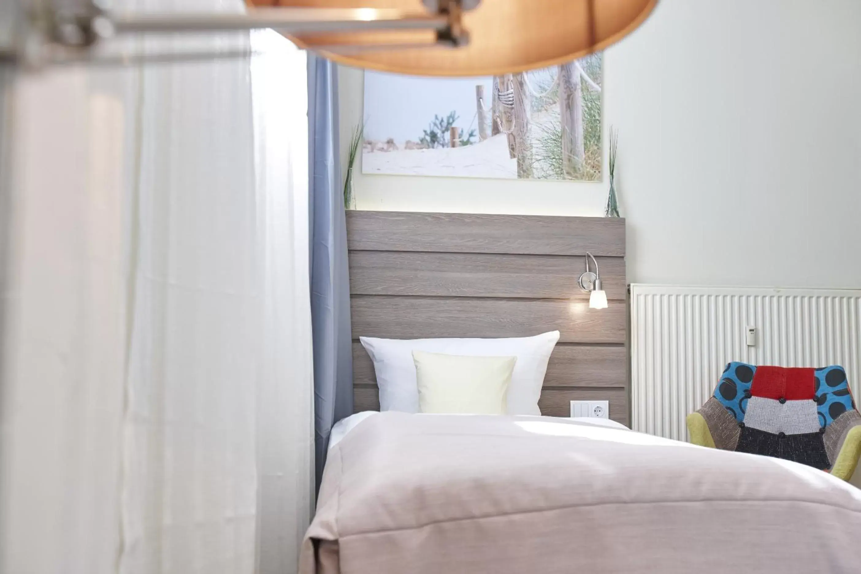 Photo of the whole room, Bed in Hotel Kiel by Golden Tulip Photo of the whole room, Bed in Hotel Kiel by Golden Tulip