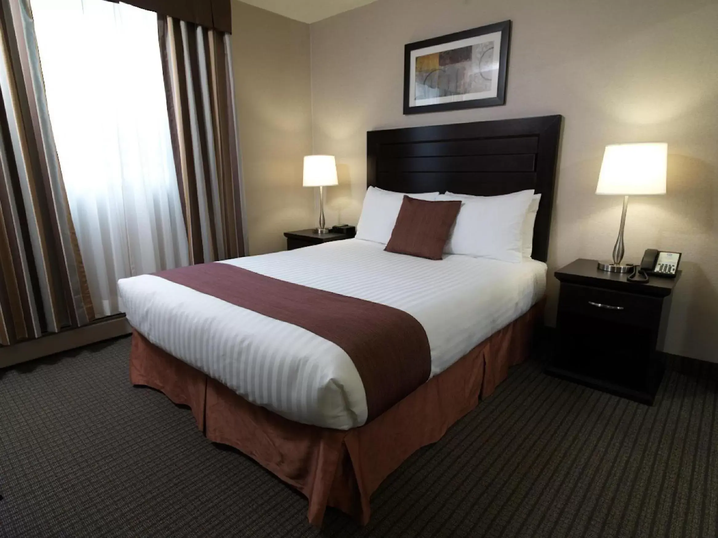 Bed in Coast Calgary Downtown Hotel & Suites by APA