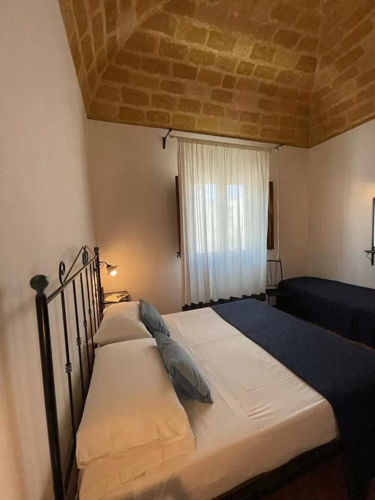 Bed in Ai Dammusi Rooms