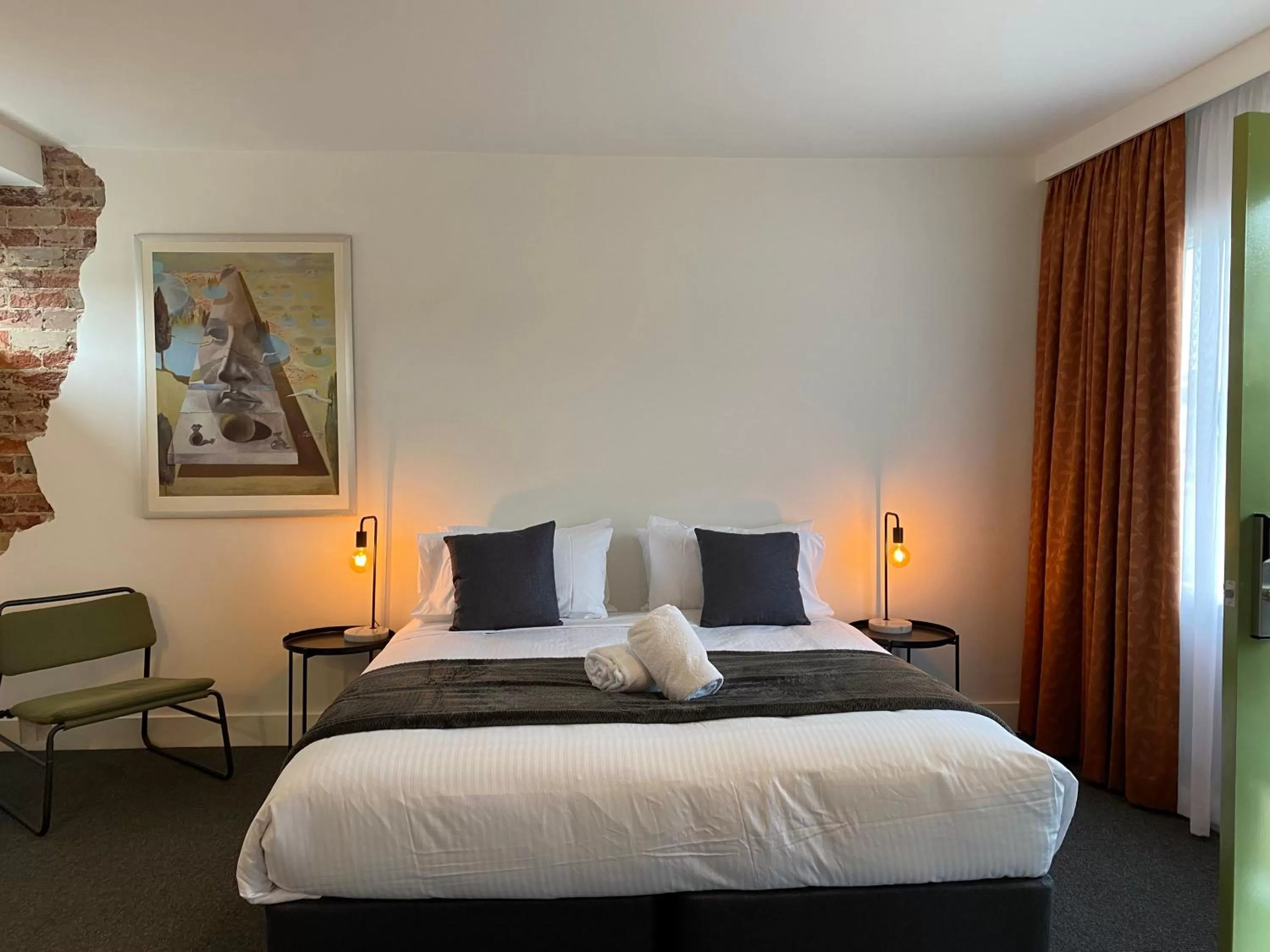 Bed in The Astor Hotel Motel