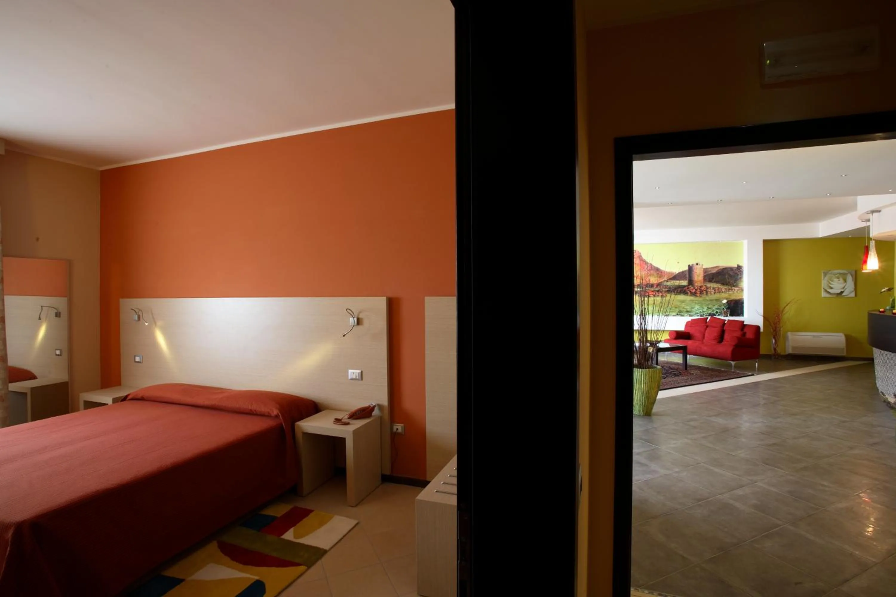 Seating area, Bed in Janus Hotel