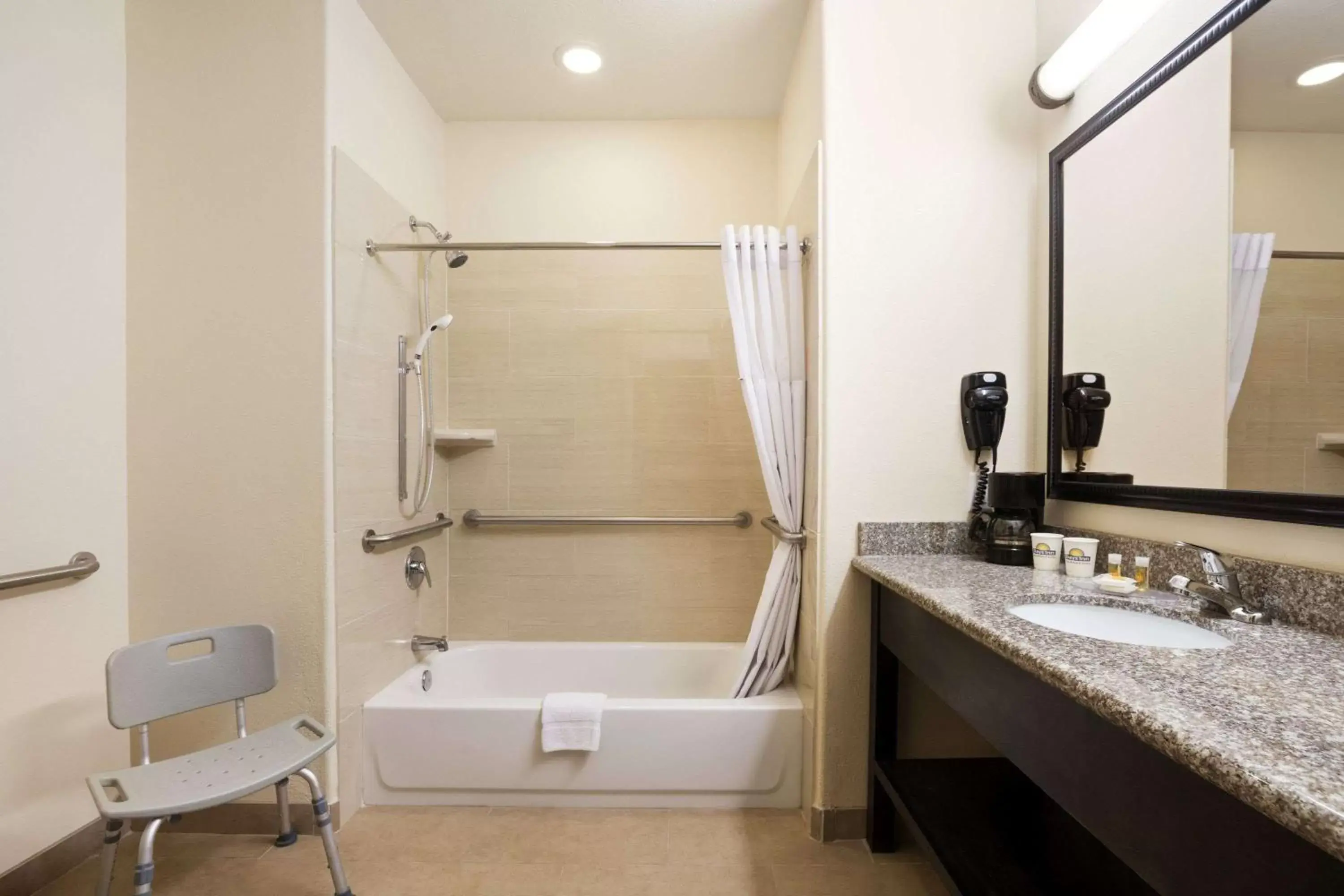 Bathroom in Days Inn & Suites by Wyndham Galveston West/Seawall