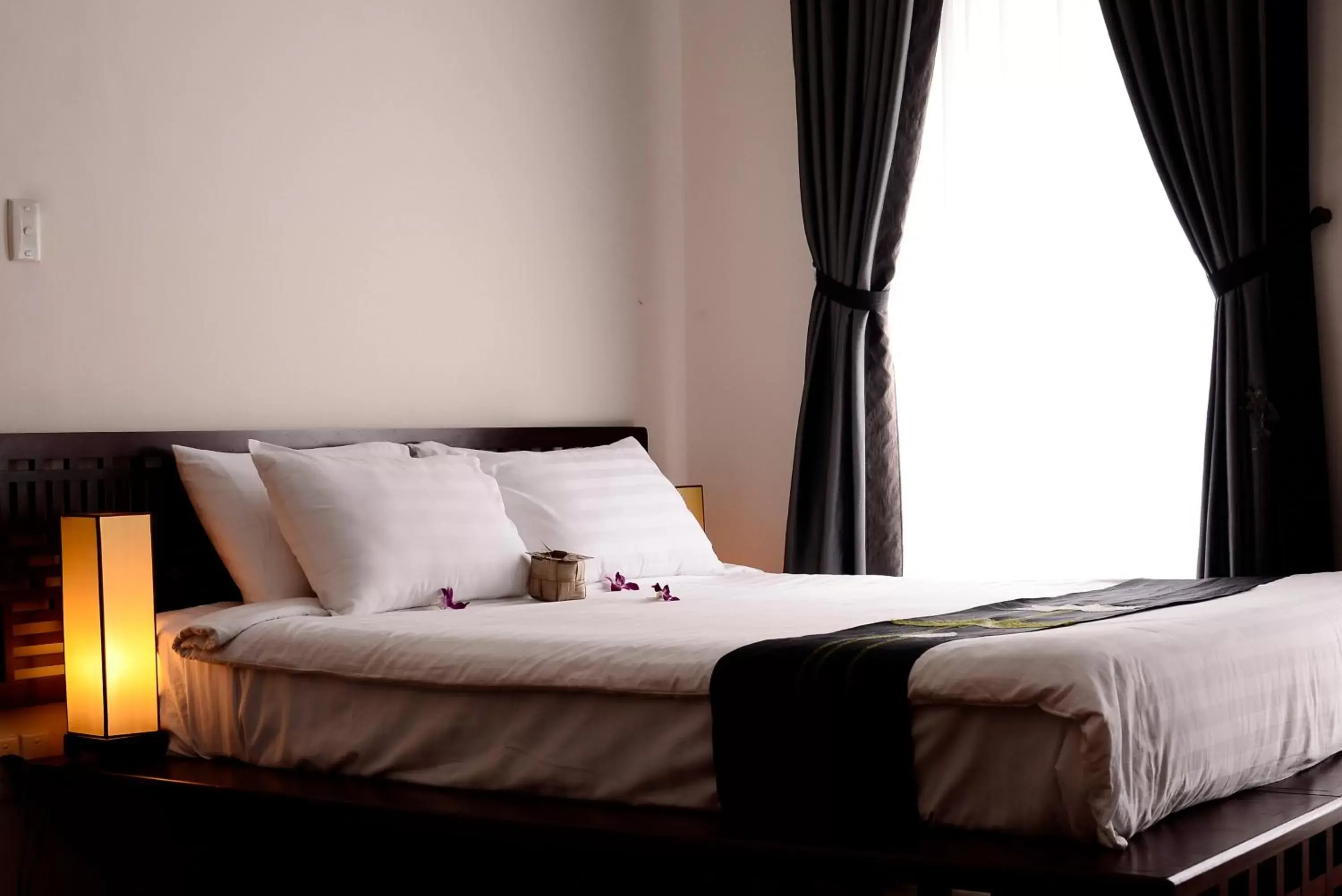 Bed in Nam Bo Boutique Hotel