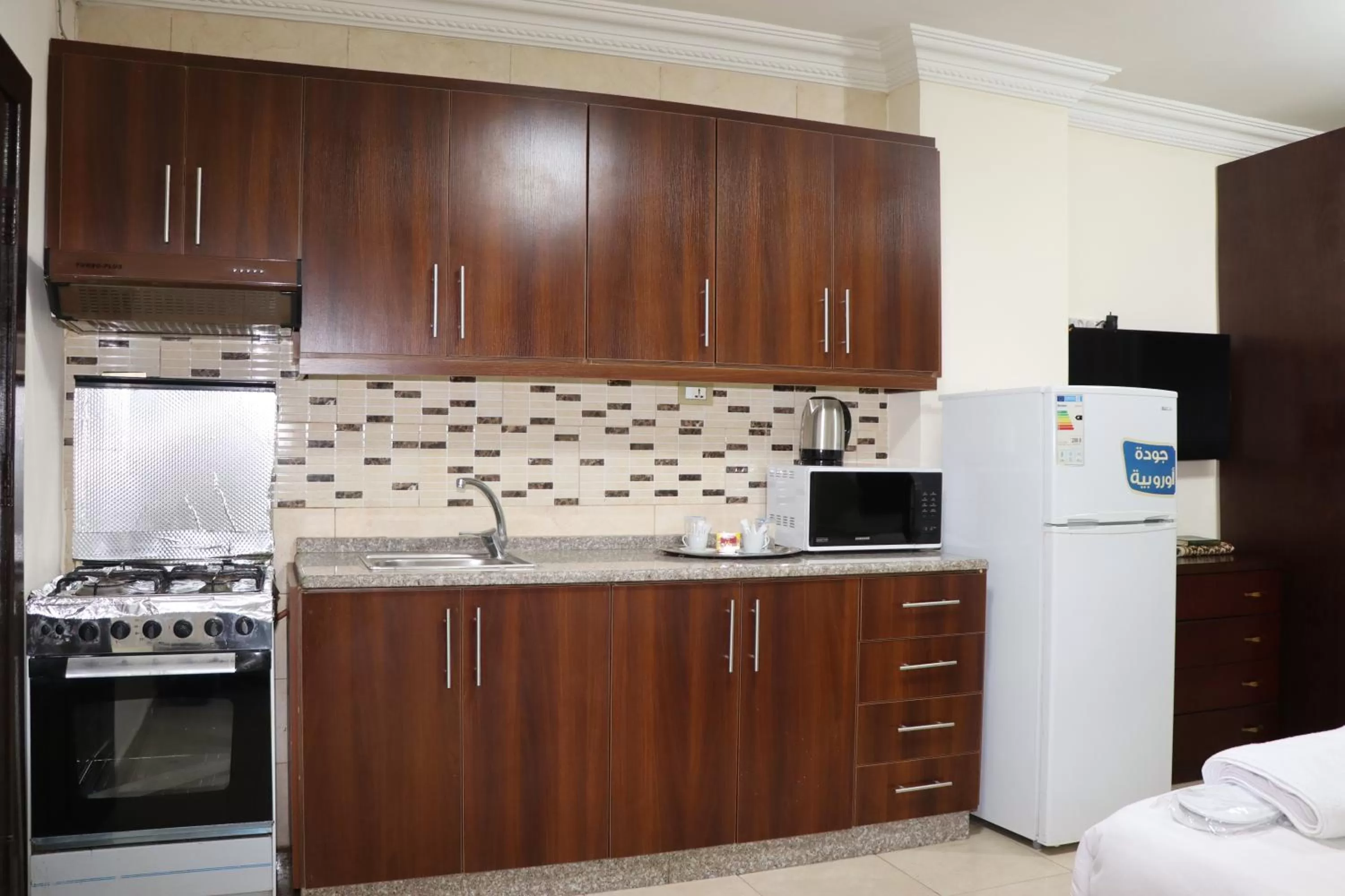 Kitchen or kitchenette in Al Jamal Suites