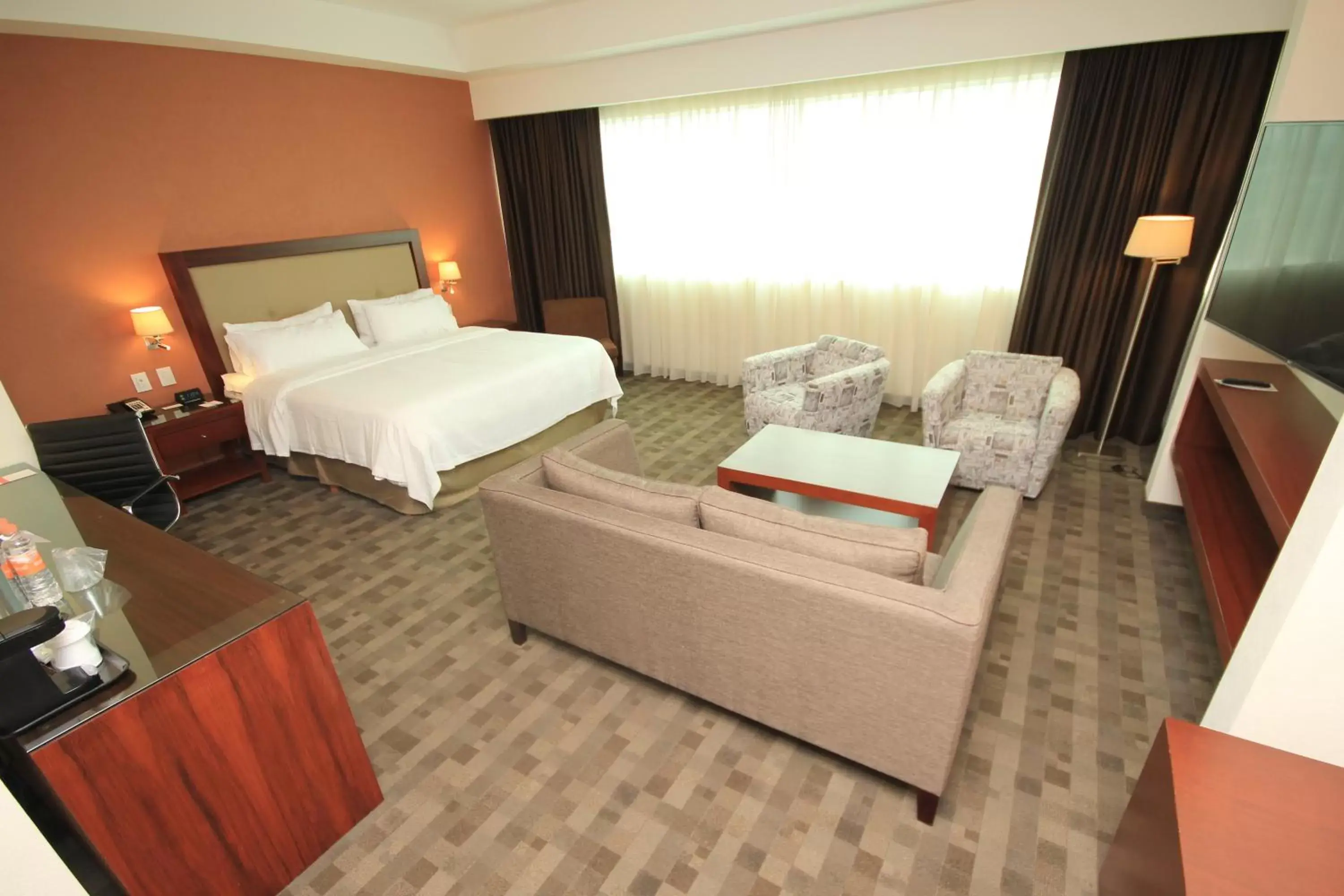 Photo of the whole room, Bed in Holiday Inn & Suites Plaza Mayor, an IHG Hotel