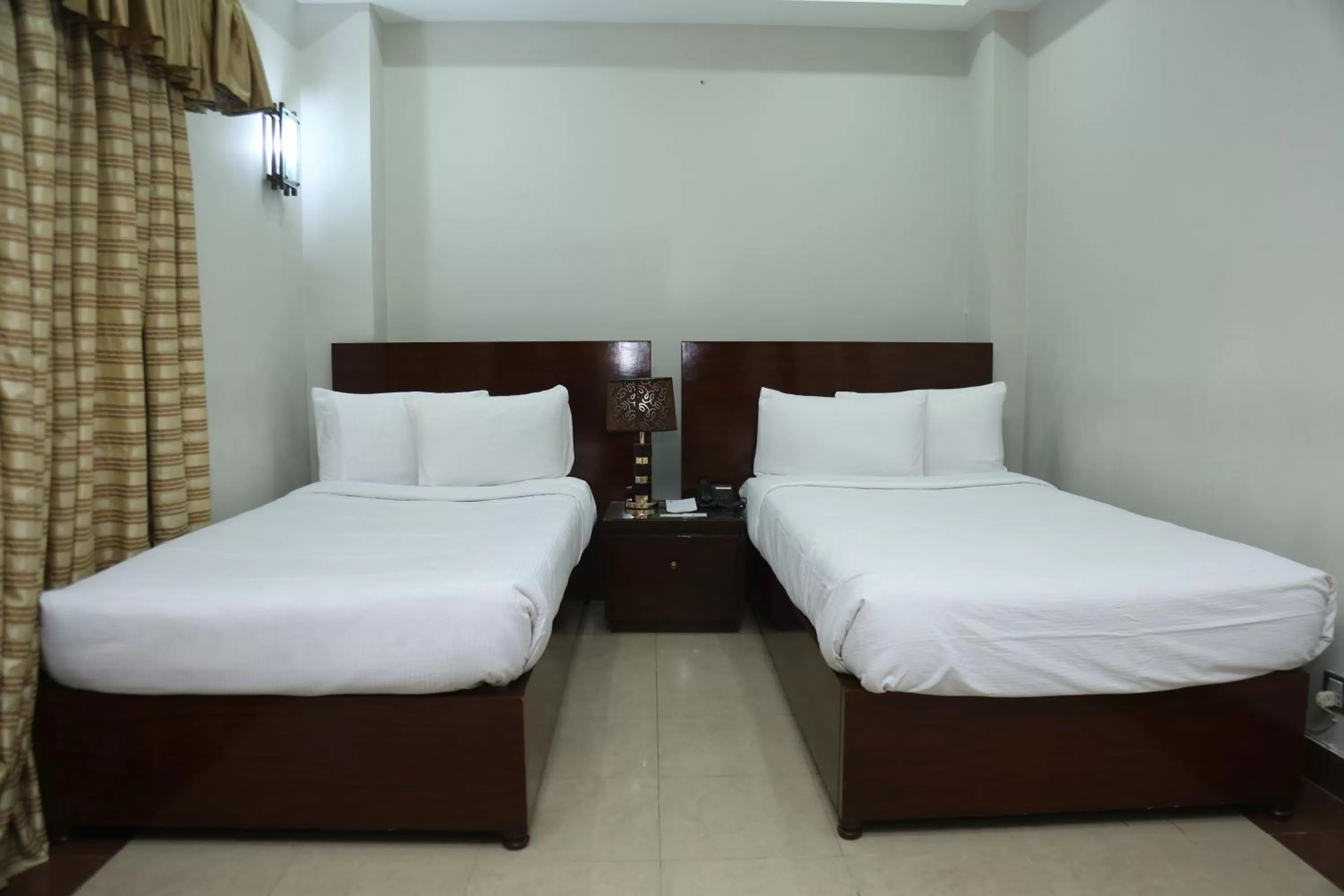 Bed in Hotel Multan Continental