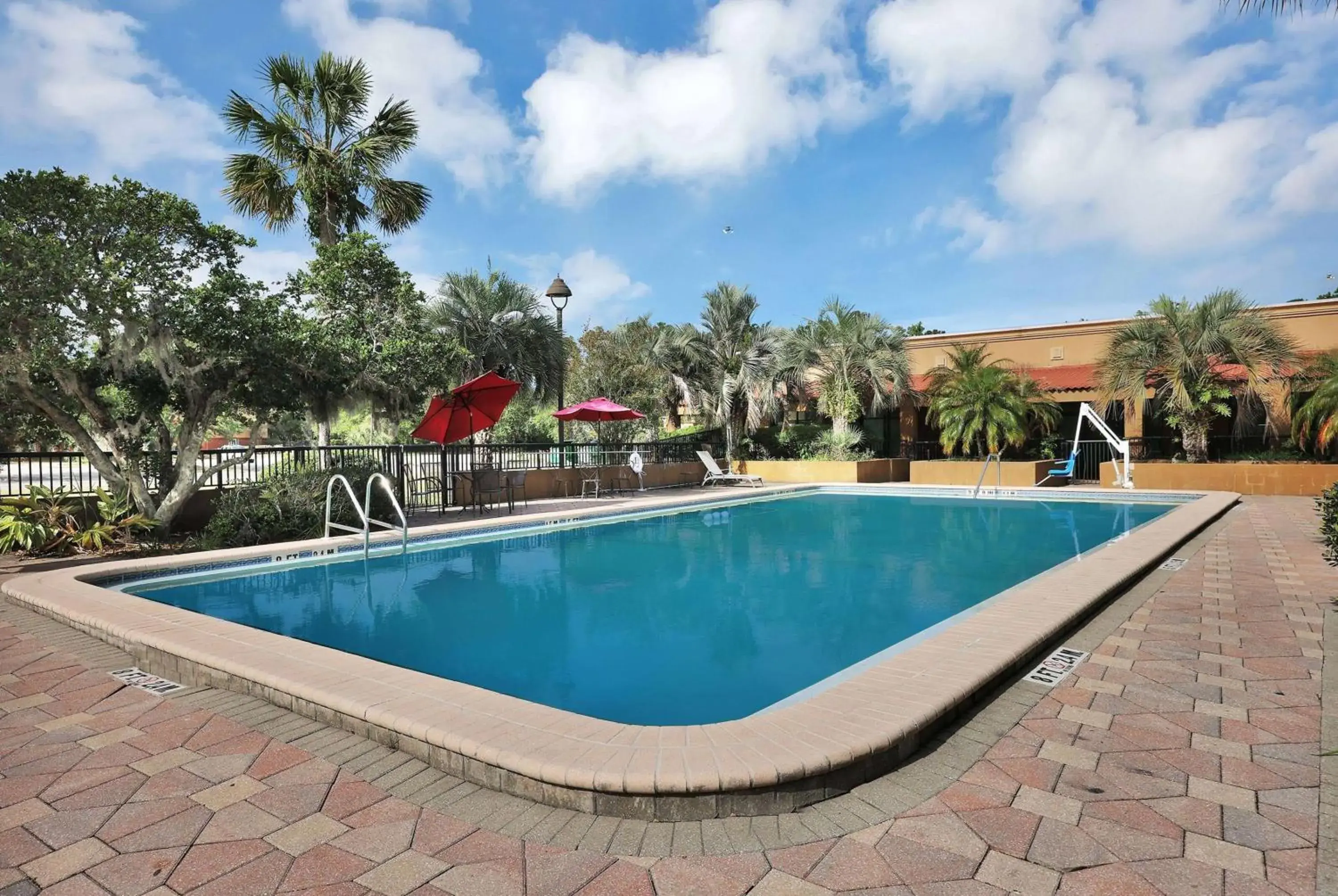Pool view, Swimming Pool in Ramada by Wyndham Jacksonville I-95 by Butler Blvd