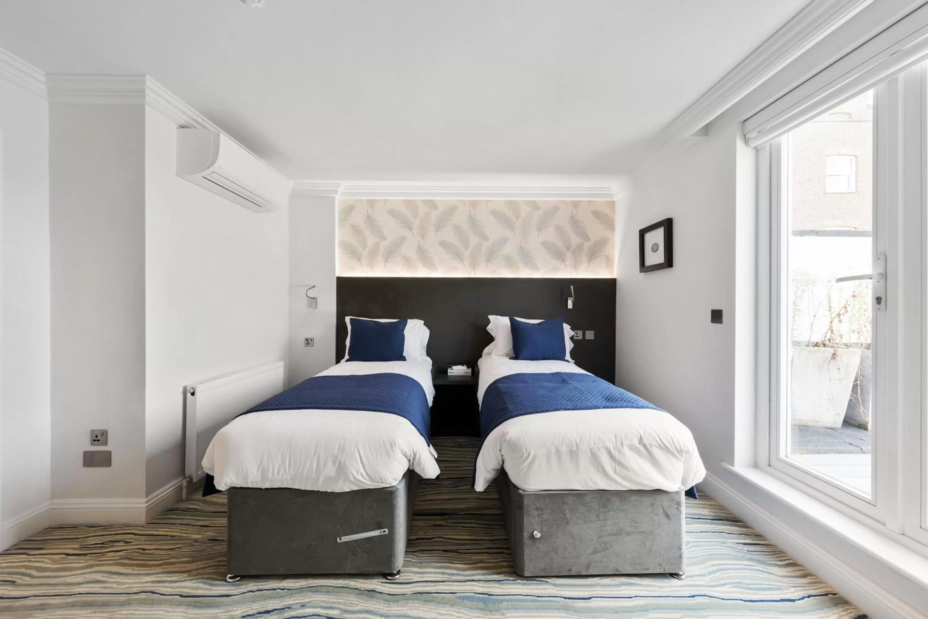 Bed in Commodore Hotel