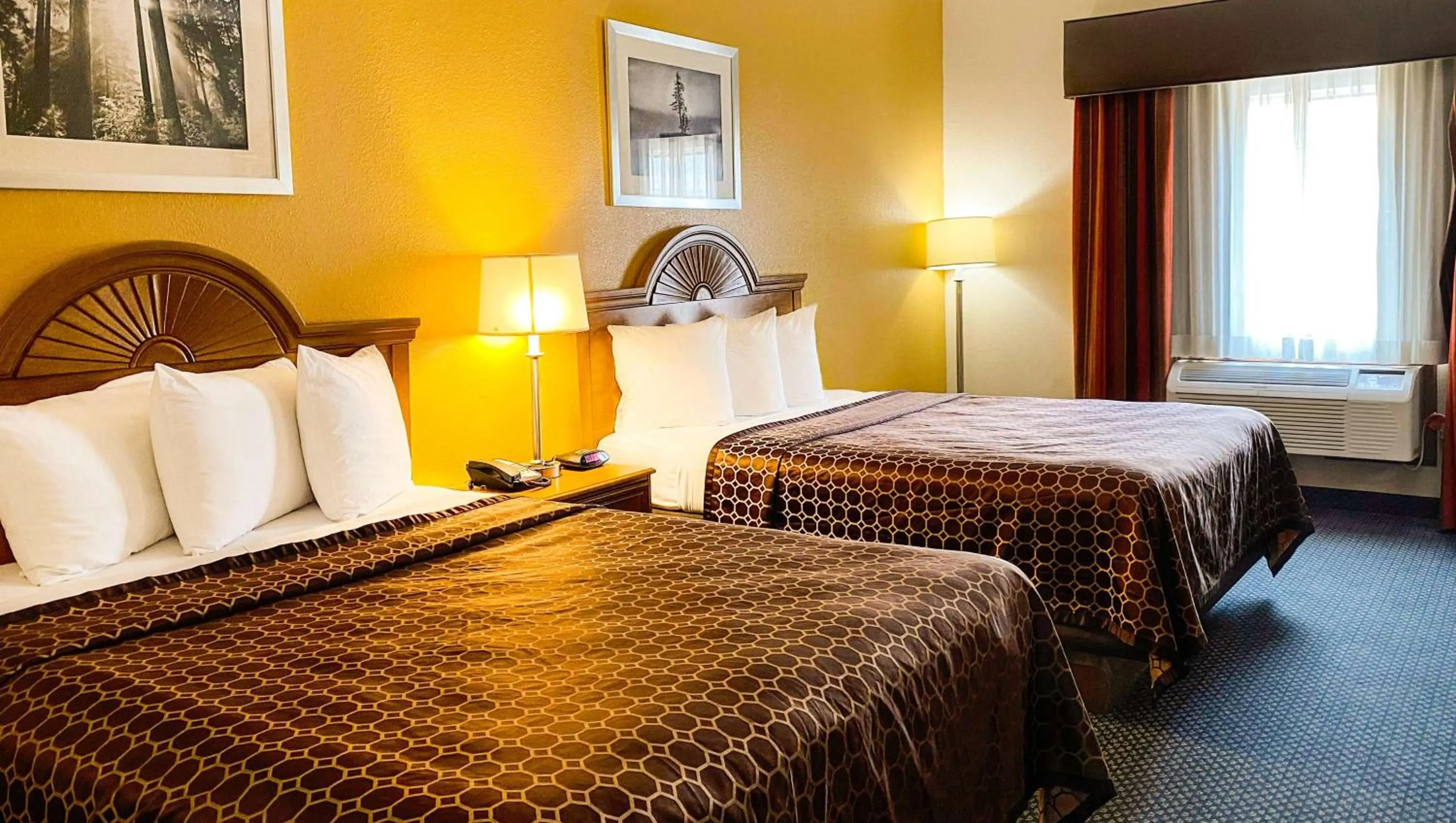 Photo of the whole room, Bed in Magnuson Hotel Sand Springs – Tulsa West