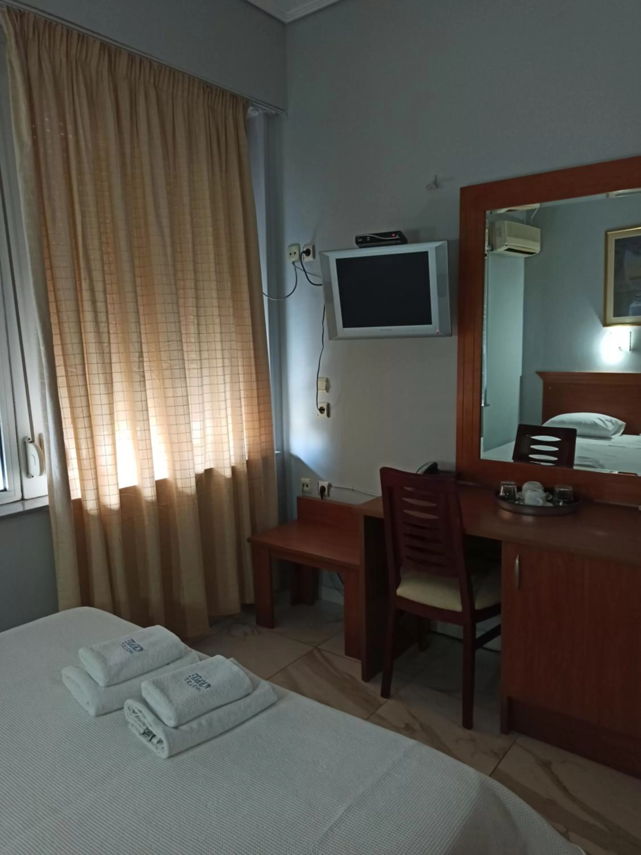 Bedroom, TV/Entertainment Center in Piraeus Acropole Hotel