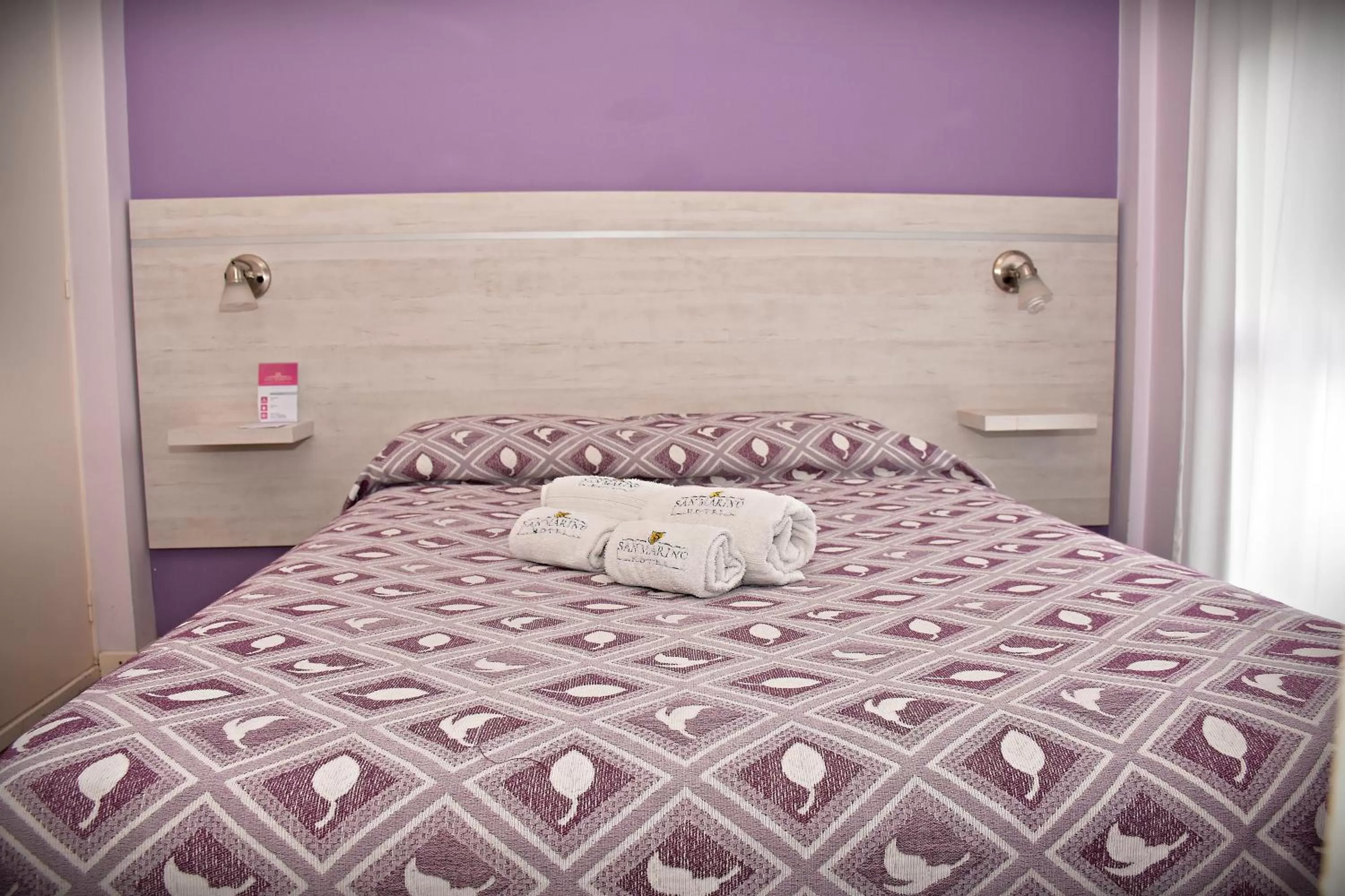 Bed in Hotel San Marino