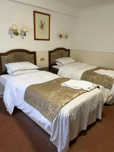 Bed in The Saracens Head Hotel