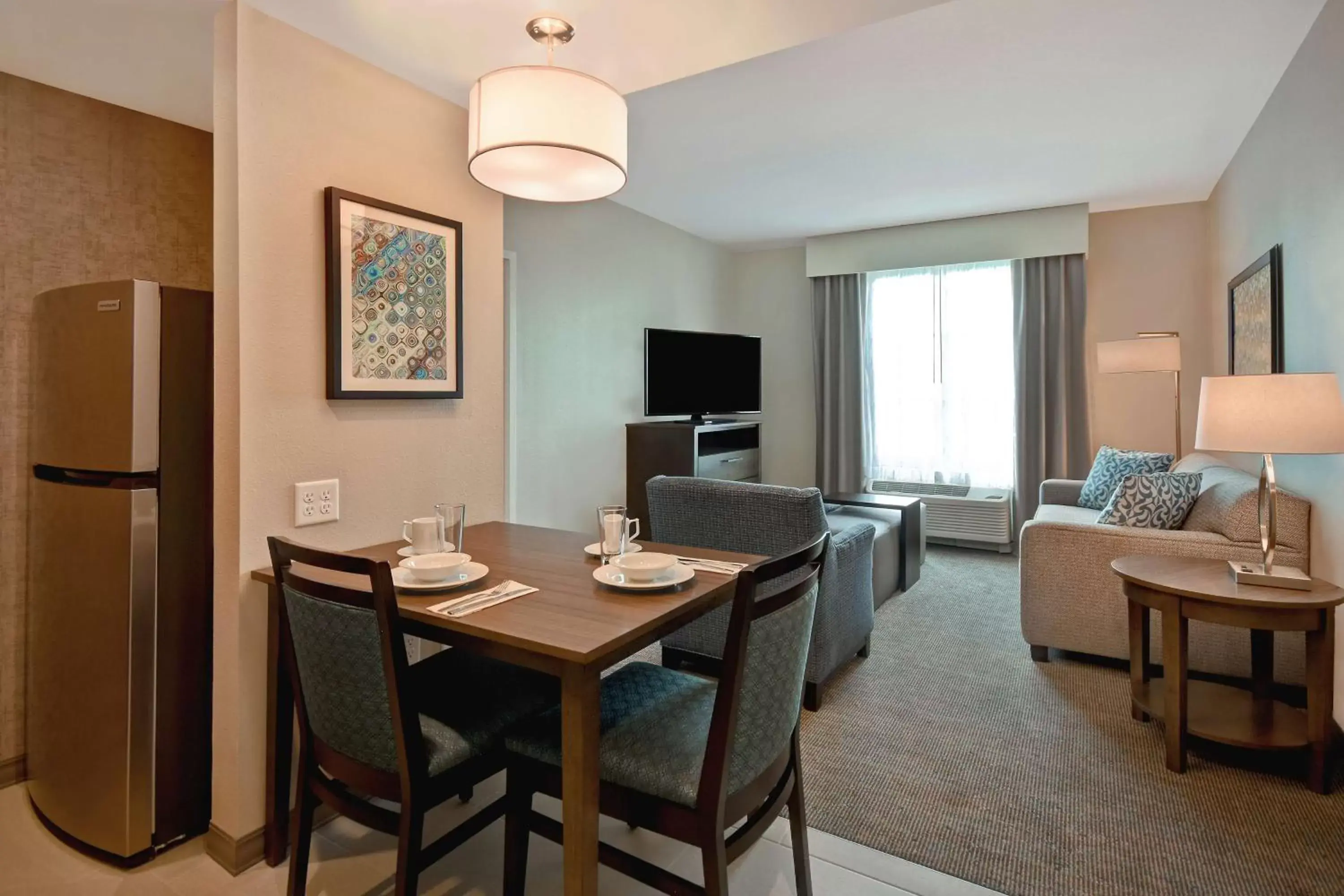 Living room, Dining Area in Homewood Suites By Hilton Orlando Flamingo Crossings, Fl