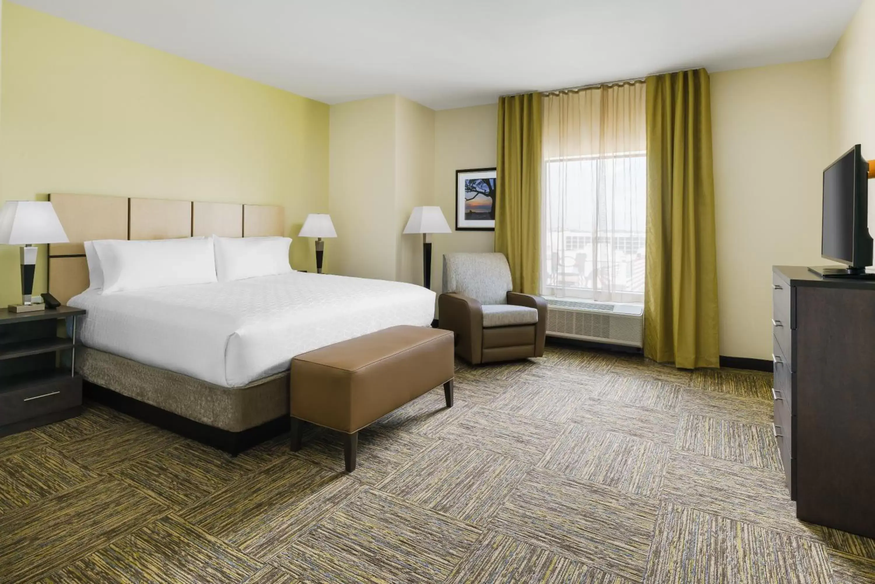 Bed in Candlewood Suites - Orlando - Lake Buena Vista, an IHG Hotel