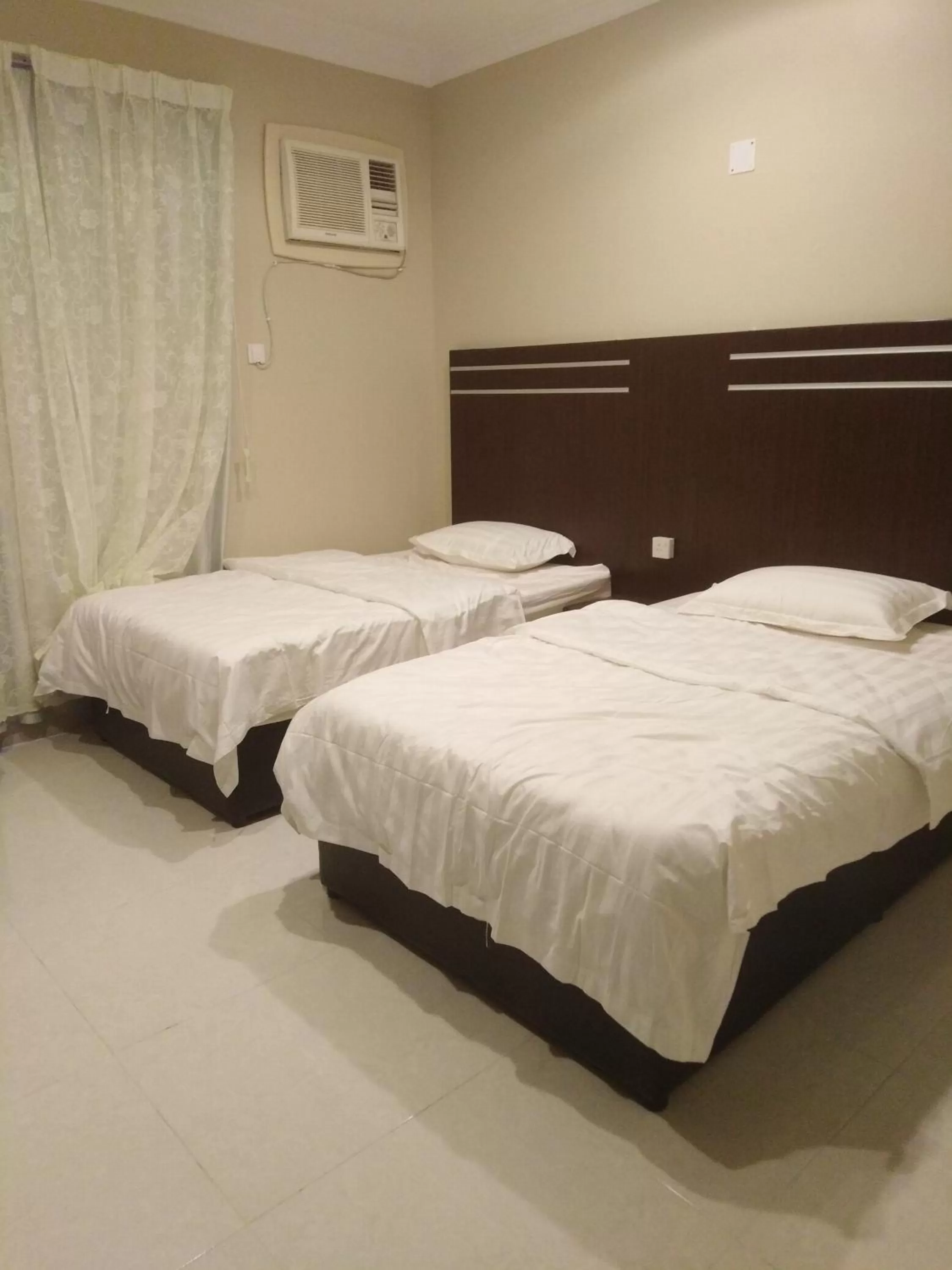 Bed in Sunrise Furnished Apartment