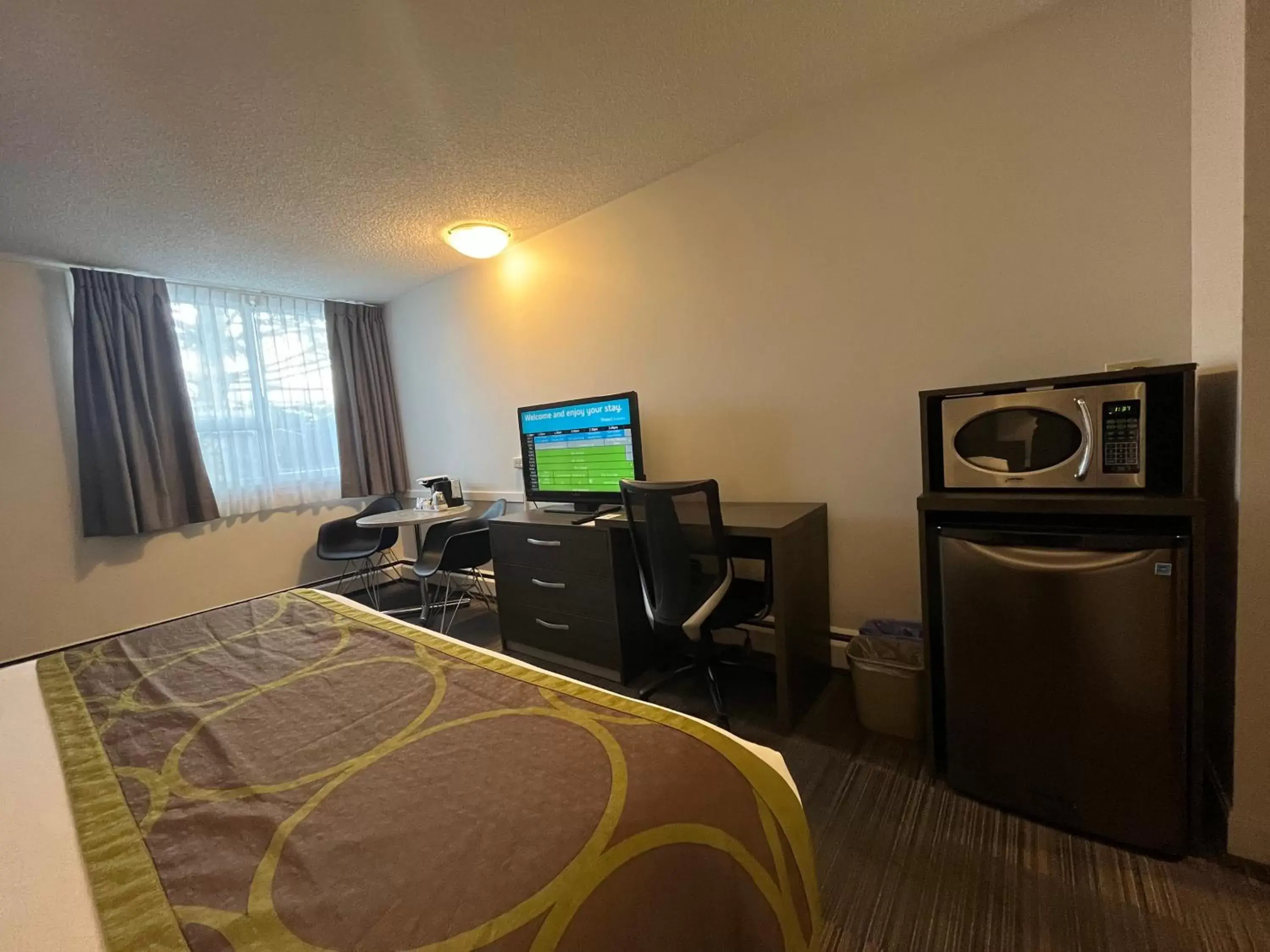 TV and multimedia, TV/Entertainment Center in Super 8 by Wyndham Macleod Trail Calgary