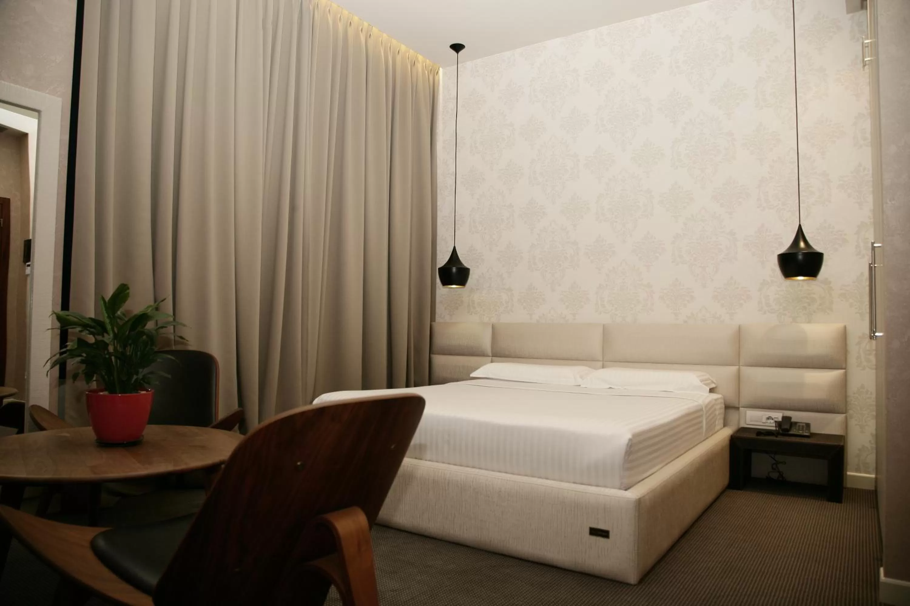 Bed in La Bohème Hotel