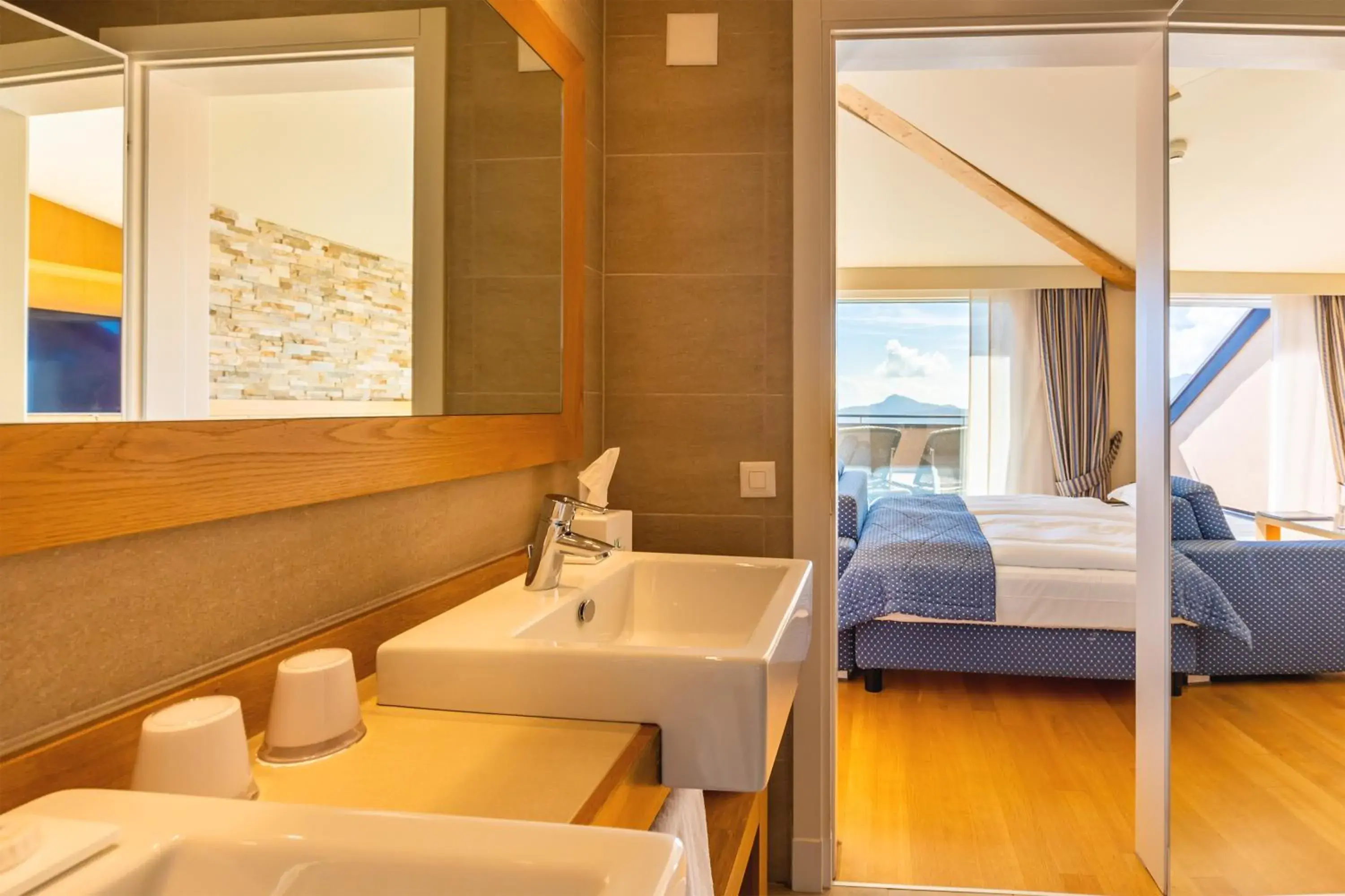 Bed, Bathroom in Kurhaus Cademario Hotel & DOT Spa - Ticino Hotels Group
