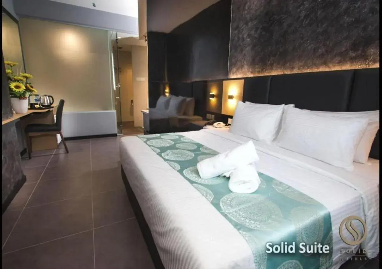 Bed in Solid Hotels