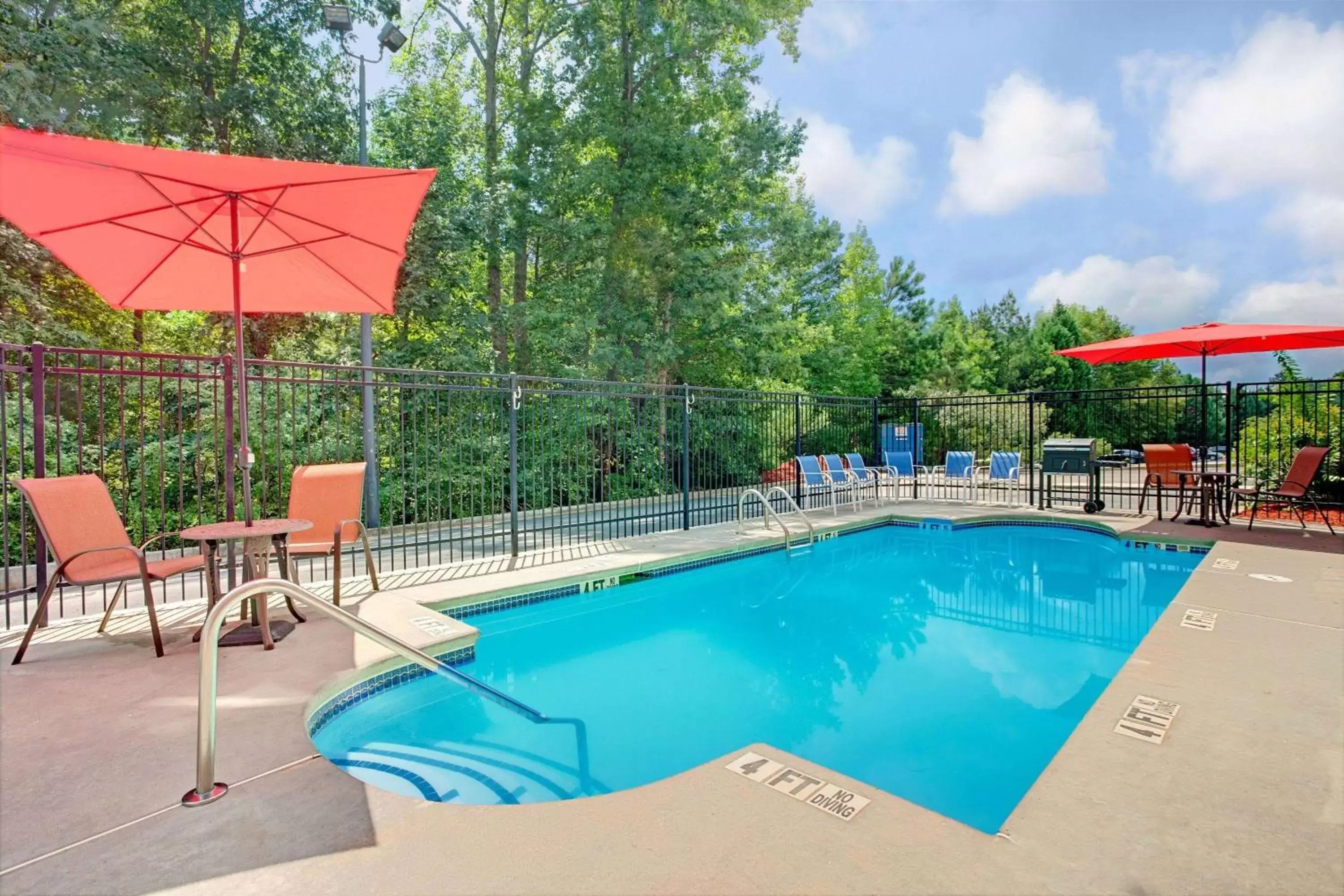 On site, Swimming Pool in Microtel Inn & Suites by Wyndham Stockbridge/Atlanta I-75